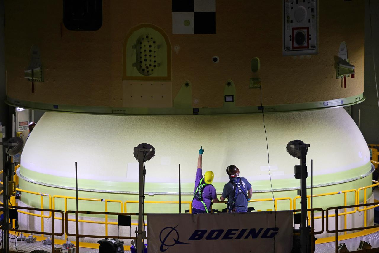 NASA’s Space Launch System (SLS) team fully stacked three hardware elements together May 24 to form the top of the rocket’s core stage for the Artemis II mission. NASA and core stage prime contractor Boeing connected the forward skirt with the liquid oxygen tank and intertank flight hardware inside an assembly area at NASA’s Michoud Assembly Facility in New Orleans. Teams had previously stacked the liquid oxygen tank and intertank on April 28. The joining of the three structures together is the first major assembly of core stage hardware for Artemis II, the first crewed Artemis mission and second flight of the SLS rocket. Next, technicians will work to complete outfitting and integrating the systems within the upper structure.   At 66 feet tall, the upper part of the stage is just a fraction of the entire core stage. The fully-assembled, 212-foot-tall rocket stage consists of five hardware elements, including two liquid propellant tanks and four RS-25 engines. The liquid oxygen tank in the upper portion of the stage will hold 196,000 gallons of liquid oxygen cooled to minus 297 degrees Fahrenheit. Meanwhile, the forward skirt and intertank house avionics, flight computer, and electronic systems for the rocket stage. Together, the core stage and its four RS-25 engines will provide more than 2 million pounds of thrust to help send Artemis II astronauts beyond Earth’s orbit to lunar orbit.   With Artemis, NASA will land the first woman and the first person of color on the Moon and establish sustainable exploration in preparation for missions to Mars. SLS and NASA’s Orion spacecraft, along with the commercial human landing system and the Gateway in orbit around the Moon, are NASA’s backbone for deep space exploration. SLS is the only rocket that can send Orion, astronauts, and supplies to the Moon in a single mission. Image credit: NASA/Michael DeMocker