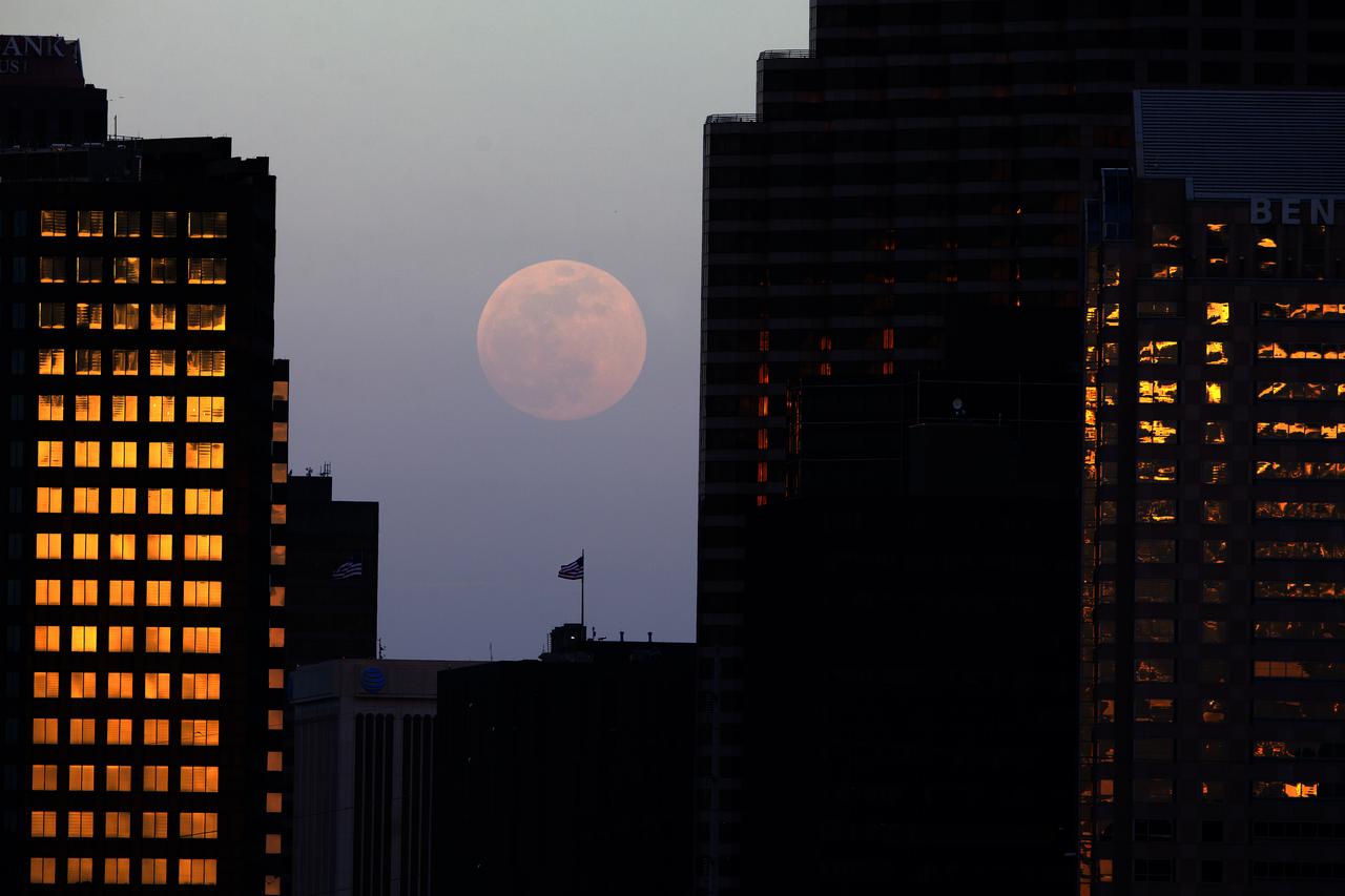 The nearly full moon rises over the city of New Orleans on Tuesday evening, May 25, 2021. Image credit: NASA/Michael DeMocker 