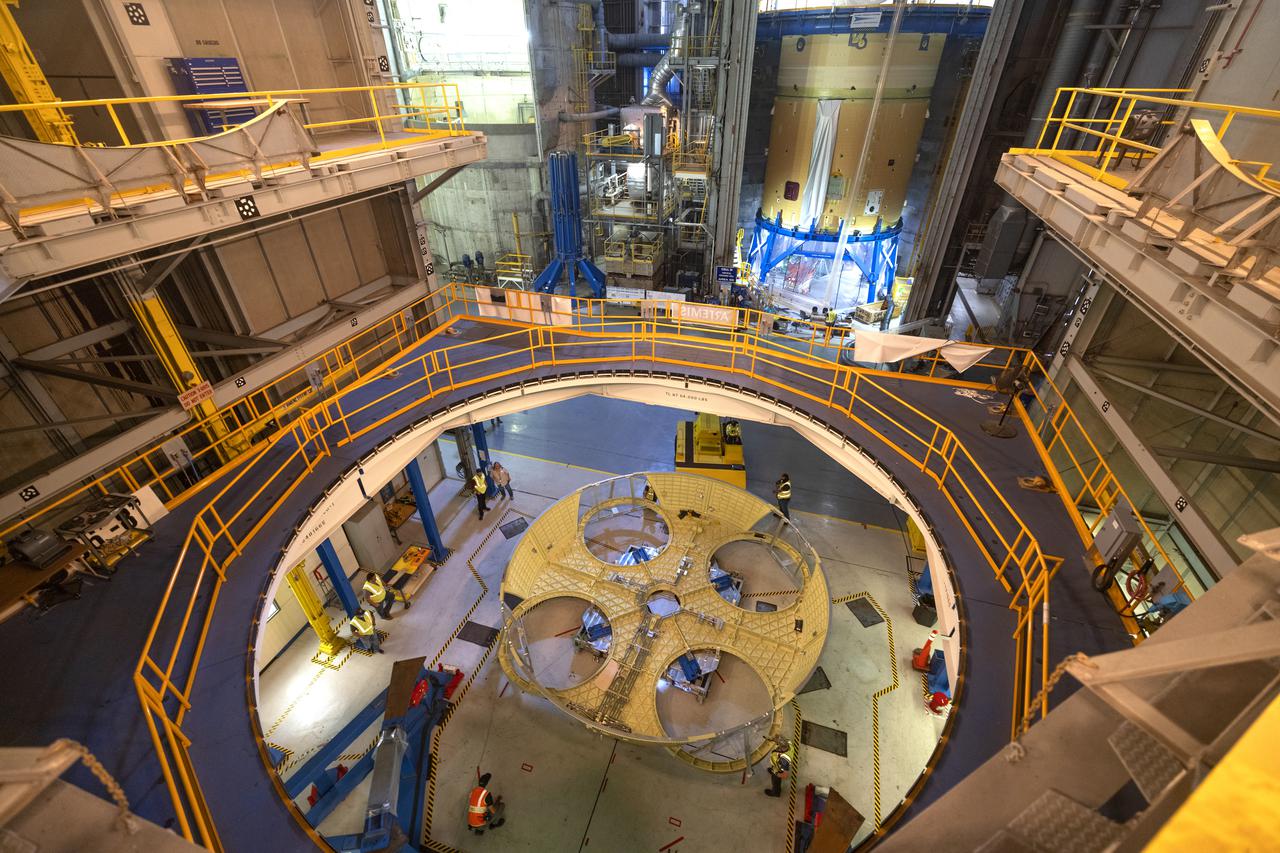 Technicians and engineers move the boat-tail structure for the core stage of NASA’s Space Launch System’s (SLS) rocket for Artemis II, the first crewed mission of NASA’s Artemis program at NASA’s Michoud Assembly Facility. The boat-tail, a fairing-like cover that attaches to the engine section on the bottom of the core stage, protects and covers most of the four RS-25 engines’ critical systems. Together with its four RS-25 engines, the rocket’s massive 212-foot-tall core stage — the largest stage NASA has ever built — and its twin solid rocket boosters will produce 8.8 million pounds of thrust to send NASA’s Orion spacecraft, astronauts and supplies beyond Earth’s orbit to the Moon and, ultimately, Mars. Offering more payload mass, volume capability and energy to speed missions through space, the SLS rocket, along with NASA’s Gateway in lunar orbit, the Human Landing System, and Orion spacecraft, is part of NASA’s backbone for deep space exploration and the Artemis lunar program. No other rocket is capable of carrying astronauts in Orion around the Moon in a single mission. Photographed on Wednesday, June 9, 2021. Image credit: NASA/Michael DeMocker