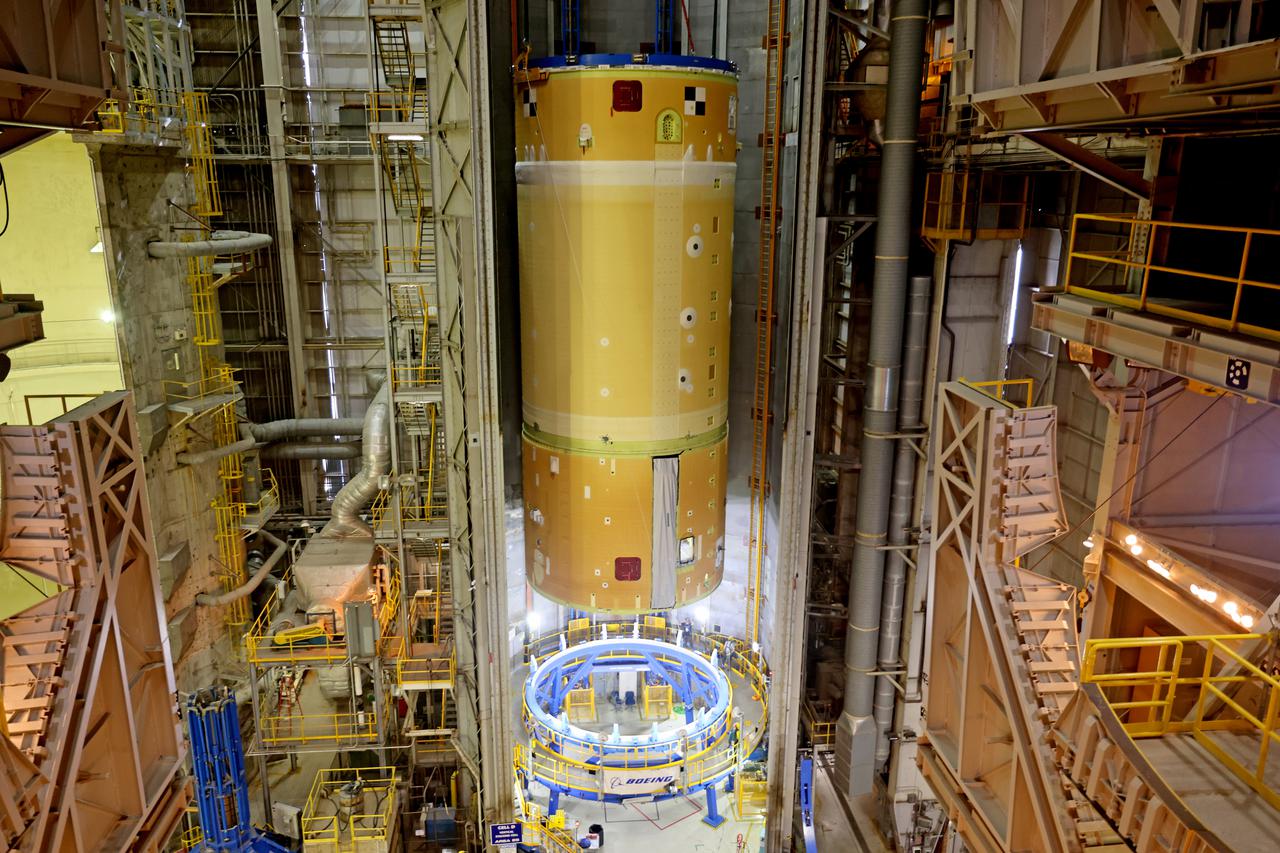 NASA has completed assembly of the upper, or forward, part of the core stage for the Space Launch System (SLS) rocket that will send the Artemis II crew on their lunar mission. Boeing, the lead core stage contractor, completed joining the forward part of the rocket, and then lifted it out of the assembly structure at NASA’s Michoud Assembly Facility in New Orleans. To construct this part of the core stage, the team first stacked three major parts of the stage—the forward skirt, the liquid oxygen tank, and the intertank. The forward skirt sits atop the rocket’s core stage, and it and the intertank are outfitted with the rocket’s flight computers and avionics systems that control SLS during launch and ascent. The liquid oxygen tank holds 196,000 gallons of liquid oxygen cooled to minus 297 degrees Fahrenheit.   The entire upper part of the stage is around 66-feet tall. The fully-assembled, 212-foot-tall rocket stage consists of five hardware elements. As the team lifted it out of the assembly area, they completed a breakover maneuver, to put the forward assembly in a horizontal position. Then, they moved it to final assembly where the Artemis II liquid hydrogen tank is also undergoing outfitting. Here, teams will connect the liquid hydrogen tank to the upper part of the rocket and complete assembly of four of the five core stage parts. The last piece to be added will be the engine section, which is currently in a separate assembly area being outfitted with propulsion systems that connect to the engines.  Image credit: NASA/Michael DeMocker