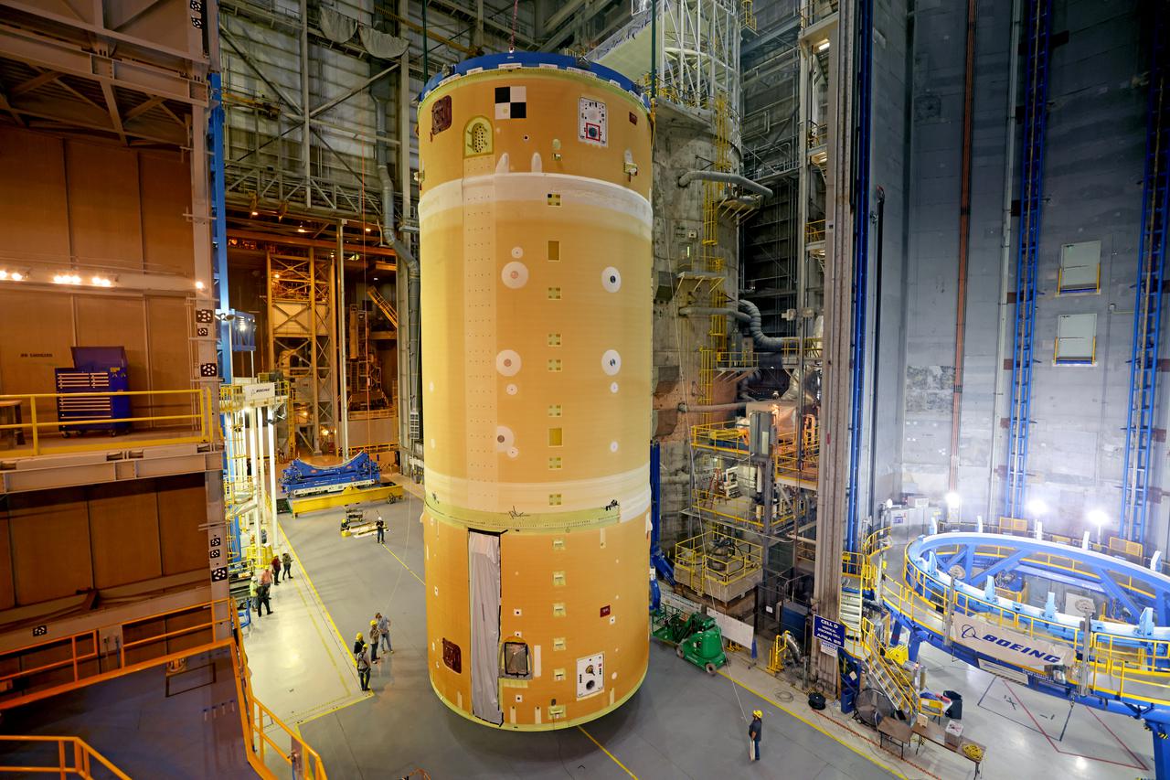 NASA has completed assembly of the upper, or forward, part of the core stage for the Space Launch System (SLS) rocket that will send the Artemis II crew on their lunar mission. Boeing, the lead core stage contractor, completed joining the forward part of the rocket, and then lifted it out of the assembly structure at NASA’s Michoud Assembly Facility in New Orleans. To construct this part of the core stage, the team first stacked three major parts of the stage—the forward skirt, the liquid oxygen tank, and the intertank. The forward skirt sits atop the rocket’s core stage, and it and the intertank are outfitted with the rocket’s flight computers and avionics systems that control SLS during launch and ascent. The liquid oxygen tank holds 196,000 gallons of liquid oxygen cooled to minus 297 degrees Fahrenheit.   The entire upper part of the stage is around 66-feet tall. The fully-assembled, 212-foot-tall rocket stage consists of five hardware elements. As the team lifted it out of the assembly area, they completed a breakover maneuver, to put the forward assembly in a horizontal position. Then, they moved it to final assembly where the Artemis II liquid hydrogen tank is also undergoing outfitting. Here, teams will connect the liquid hydrogen tank to the upper part of the rocket and complete assembly of four of the five core stage parts. The last piece to be added will be the engine section, which is currently in a separate assembly area being outfitted with propulsion systems that connect to the engines.  Image credit: NASA/Michael DeMocker