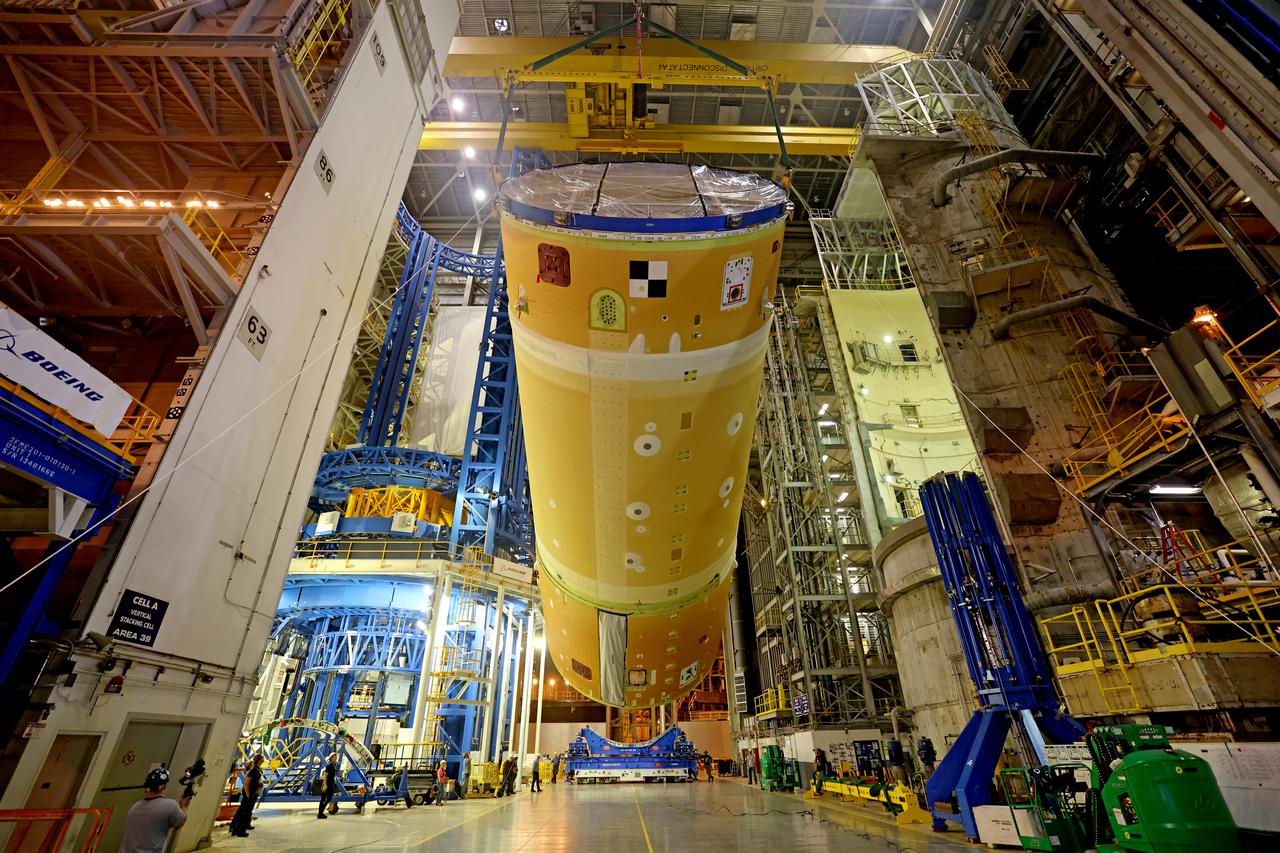NASA has completed assembly of the upper, or forward, part of the core stage for the Space Launch System (SLS) rocket that will send the Artemis II crew on their lunar mission. Boeing, the lead core stage contractor, completed joining the forward part of the rocket, and then lifted it out of the assembly structure at NASA’s Michoud Assembly Facility in New Orleans. To construct this part of the core stage, the team first stacked three major parts of the stage—the forward skirt, the liquid oxygen tank, and the intertank. The forward skirt sits atop the rocket’s core stage, and it and the intertank are outfitted with the rocket’s flight computers and avionics systems that control SLS during launch and ascent. The liquid oxygen tank holds 196,000 gallons of liquid oxygen cooled to minus 297 degrees Fahrenheit.   The entire upper part of the stage is around 66-feet tall. The fully-assembled, 212-foot-tall rocket stage consists of five hardware elements. As the team lifted it out of the assembly area, they completed a breakover maneuver, to put the forward assembly in a horizontal position. Then, they moved it to final assembly where the Artemis II liquid hydrogen tank is also undergoing outfitting. Here, teams will connect the liquid hydrogen tank to the upper part of the rocket and complete assembly of four of the five core stage parts. The last piece to be added will be the engine section, which is currently in a separate assembly area being outfitted with propulsion systems that connect to the engines.  Image credit: NASA/Michael DeMocker