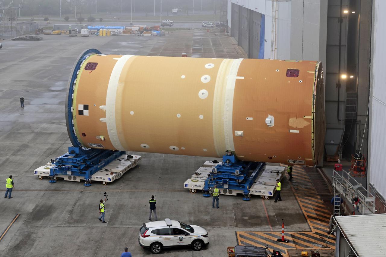 NASA has completed assembly of the upper, or forward, part of the core stage for the Space Launch System (SLS) rocket that will send the Artemis II crew on their lunar mission. Boeing, the lead core stage contractor, completed joining the forward part of the rocket, and then lifted it out of the assembly structure at NASA’s Michoud Assembly Facility in New Orleans. To construct this part of the core stage, the team first stacked three major parts of the stage—the forward skirt, the liquid oxygen tank, and the intertank. The forward skirt sits atop the rocket’s core stage, and it and the intertank are outfitted with the rocket’s flight computers and avionics systems that control SLS during launch and ascent. The liquid oxygen tank holds 196,000 gallons of liquid oxygen cooled to minus 297 degrees Fahrenheit.   The entire upper part of the stage is around 66-feet tall. The fully-assembled, 212-foot-tall rocket stage consists of five hardware elements. As the team lifted it out of the assembly area, they completed a breakover maneuver, to put the forward assembly in a horizontal position. Then, they moved it to final assembly where the Artemis II liquid hydrogen tank is also undergoing outfitting. Here, teams will connect the liquid hydrogen tank to the upper part of the rocket and complete assembly of four of the five core stage parts. The last piece to be added will be the engine section, which is currently in a separate assembly area being outfitted with propulsion systems that connect to the engines.  Image credit: NASA/Michael DeMocker