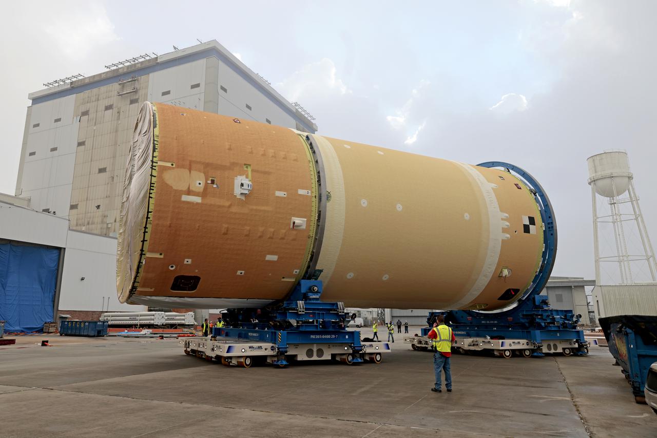NASA has completed assembly of the upper, or forward, part of the core stage for the Space Launch System (SLS) rocket that will send the Artemis II crew on their lunar mission. Boeing, the lead core stage contractor, completed joining the forward part of the rocket, and then lifted it out of the assembly structure at NASA’s Michoud Assembly Facility in New Orleans. To construct this part of the core stage, the team first stacked three major parts of the stage—the forward skirt, the liquid oxygen tank, and the intertank. The forward skirt sits atop the rocket’s core stage, and it and the intertank are outfitted with the rocket’s flight computers and avionics systems that control SLS during launch and ascent. The liquid oxygen tank holds 196,000 gallons of liquid oxygen cooled to minus 297 degrees Fahrenheit.   The entire upper part of the stage is around 66-feet tall. The fully-assembled, 212-foot-tall rocket stage consists of five hardware elements. As the team lifted it out of the assembly area, they completed a breakover maneuver, to put the forward assembly in a horizontal position. Then, they moved it to final assembly where the Artemis II liquid hydrogen tank is also undergoing outfitting. Here, teams will connect the liquid hydrogen tank to the upper part of the rocket and complete assembly of four of the five core stage parts. The last piece to be added will be the engine section, which is currently in a separate assembly area being outfitted with propulsion systems that connect to the engines.  Image credit: NASA/Michael DeMocker