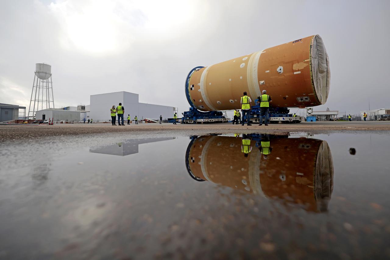 NASA has completed assembly of the upper, or forward, part of the core stage for the Space Launch System (SLS) rocket that will send the Artemis II crew on their lunar mission. Boeing, the lead core stage contractor, completed joining the forward part of the rocket, and then lifted it out of the assembly structure at NASA’s Michoud Assembly Facility in New Orleans. To construct this part of the core stage, the team first stacked three major parts of the stage—the forward skirt, the liquid oxygen tank, and the intertank. The forward skirt sits atop the rocket’s core stage, and it and the intertank are outfitted with the rocket’s flight computers and avionics systems that control SLS during launch and ascent. The liquid oxygen tank holds 196,000 gallons of liquid oxygen cooled to minus 297 degrees Fahrenheit.   The entire upper part of the stage is around 66-feet tall. The fully-assembled, 212-foot-tall rocket stage consists of five hardware elements. As the team lifted it out of the assembly area, they completed a breakover maneuver, to put the forward assembly in a horizontal position. Then, they moved it to final assembly where the Artemis II liquid hydrogen tank is also undergoing outfitting. Here, teams will connect the liquid hydrogen tank to the upper part of the rocket and complete assembly of four of the five core stage parts. The last piece to be added will be the engine section, which is currently in a separate assembly area being outfitted with propulsion systems that connect to the engines.  Image credit: NASA/Michael DeMocker