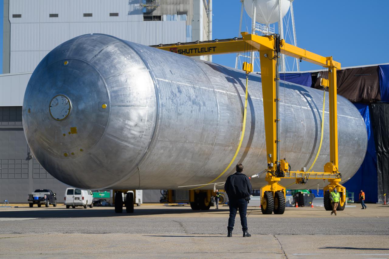 The liquid hydrogen tank that will be part of the Space Launch System rocket’s core stage is being prepared for the Artemis III mission at NASA’s Michoud Assembly Facility in New Orleans. Eventually, the tank will be connected to the engine section that will house the four RS-25 engines.  Once the aft simulator is attached, the LH2 tank undergoes non-destructive evaluation, which will test weld strength and ensure the tank is structurally sound.  The SLS core stage is made up of five unique elements: the forward skirt, liquid oxygen tank, intertank, liquid hydrogen tank, and the engine section. The tank holds 537,000 gallons of liquid hydrogen cooled to minus 432 degrees Fahrenheit and sits between the core stage’s intertank and engine section. The liquid hydrogen hardware, along with the liquid oxygen tank, will provide propellant to the four RS-25 engines at the bottom of the core stage to produce more than two million pounds of thrust to help launch the Artemis III mission to the Moon. Together with its four RS-25 engines, the rocket’s massive 212-foot-tall core stage — the largest stage NASA has ever built — and its twin solid rocket boosters will produce 8.8 million pounds of thrust to send NASA’s Orion spacecraft, astronauts and supplies beyond Earth’s orbit to the Moon.  