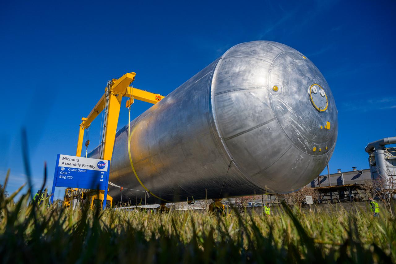 The liquid hydrogen tank that will be part of the Space Launch System rocket’s core stage is being prepared for the Artemis III mission at NASA’s Michoud Assembly Facility in New Orleans. Eventually, the tank will be connected to the engine section that will house the four RS-25 engines.  Once the aft simulator is attached, the LH2 tank undergoes non-destructive evaluation, which will test weld strength and ensure the tank is structurally sound.  The SLS core stage is made up of five unique elements: the forward skirt, liquid oxygen tank, intertank, liquid hydrogen tank, and the engine section. The tank holds 537,000 gallons of liquid hydrogen cooled to minus 432 degrees Fahrenheit and sits between the core stage’s intertank and engine section. The liquid hydrogen hardware, along with the liquid oxygen tank, will provide propellant to the four RS-25 engines at the bottom of the core stage to produce more than two million pounds of thrust to help launch the Artemis III mission to the Moon. Together with its four RS-25 engines, the rocket’s massive 212-foot-tall core stage — the largest stage NASA has ever built — and its twin solid rocket boosters will produce 8.8 million pounds of thrust to send NASA’s Orion spacecraft, astronauts and supplies beyond Earth’s orbit to the Moon.  