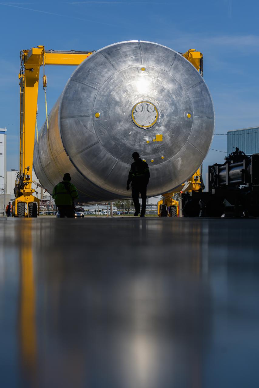 The liquid hydrogen tank that will be part of the Space Launch System rocket’s core stage is being prepared for the Artemis III mission at NASA’s Michoud Assembly Facility in New Orleans. Eventually, the tank will be connected to the engine section that will house the four RS-25 engines.  Once the aft simulator is attached, the LH2 tank undergoes non-destructive evaluation, which will test weld strength and ensure the tank is structurally sound.  The SLS core stage is made up of five unique elements: the forward skirt, liquid oxygen tank, intertank, liquid hydrogen tank, and the engine section. The tank holds 537,000 gallons of liquid hydrogen cooled to minus 432 degrees Fahrenheit and sits between the core stage’s intertank and engine section. The liquid hydrogen hardware, along with the liquid oxygen tank, will provide propellant to the four RS-25 engines at the bottom of the core stage to produce more than two million pounds of thrust to help launch the Artemis III mission to the Moon. Together with its four RS-25 engines, the rocket’s massive 212-foot-tall core stage — the largest stage NASA has ever built — and its twin solid rocket boosters will produce 8.8 million pounds of thrust to send NASA’s Orion spacecraft, astronauts and supplies beyond Earth’s orbit to the Moon.  