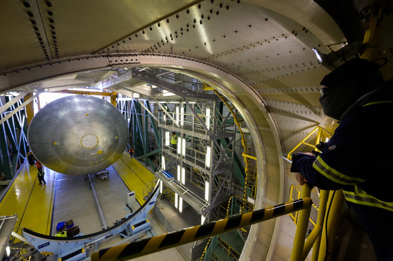 The liquid hydrogen tank that will be part of the Space Launch System rocket’s core stage is being prepared for the Artemis III mission at NASA’s Michoud Assembly Facility in New Orleans. Eventually, the tank will be connected to the engine section that will house the four RS-25 engines.  Once the aft simulator is attached, the LH2 tank undergoes non-destructive evaluation, which will test weld strength and ensure the tank is structurally sound.  The SLS core stage is made up of five unique elements: the forward skirt, liquid oxygen tank, intertank, liquid hydrogen tank, and the engine section. The tank holds 537,000 gallons of liquid hydrogen cooled to minus 432 degrees Fahrenheit and sits between the core stage’s intertank and engine section. The liquid hydrogen hardware, along with the liquid oxygen tank, will provide propellant to the four RS-25 engines at the bottom of the core stage to produce more than two million pounds of thrust to help launch the Artemis III mission to the Moon. Together with its four RS-25 engines, the rocket’s massive 212-foot-tall core stage — the largest stage NASA has ever built — and its twin solid rocket boosters will produce 8.8 million pounds of thrust to send NASA’s Orion spacecraft, astronauts and supplies beyond Earth’s orbit to the Moon.  