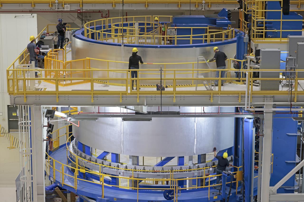 On Thursday, February 10, 2022, move crews at NASA’s Michoud Assembly Facility lift the core stage 3 liquid oxygen tank (LOX) aft barrel out of the vertical friction stir weld tool to be moved for its next phase of production. Eventually, the aft barrel will be mated with the forward barrel and forward and aft domes to create the LOX tank, which will be used for the Space Launch System’s Artemis III mission. The LOX tank holds 196,000 gallons of super-cooled liquid oxygen to help fuel four RS-25 engines. The SLS core stage is made up of five unique elements: the forward skirt, liquid oxygen tank, intertank, liquid hydrogen tank, and the engine section. The liquid oxygen hardware, along with the liquid hydrogen tank will provide propellant to the four RS-25 engines to produce more than two million pounds of thrust to help launch NASA’s Orion spacecraft, astronauts, and supplies beyond Earth’s orbit to the Moon. Image credit: NASA/Michael DeMocker