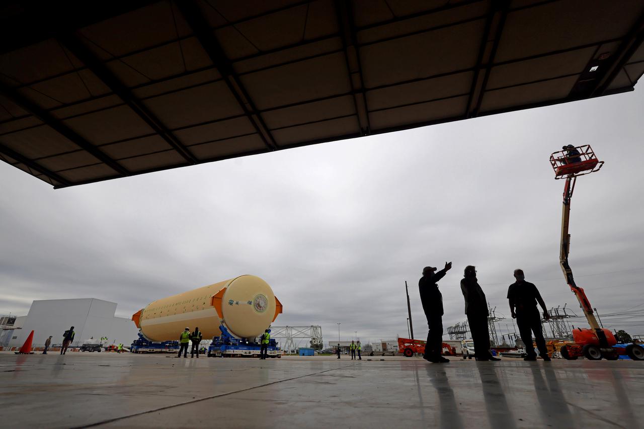 NASA is preparing major pieces of the Space Launch System rocket’s core stage to be joined as part of assembling the core stage for the Artemis II mission that will send crews to lunar orbit. Crews will soon connect the forward assembly with the 130-foot liquid hydrogen tank in the final assembly area at NASA’s Michoud Assembly Facility in New Orleans. When this process is completed, four of the five large structures that make up the core stage will be joined. The 66-foot forward assembly consists of the forward skirt, liquid oxygen tank and the intertank, which were mated earlier. This forward assembly will be joined with the 130-foot liquid hydrogen tank, the largest part of the stage that holds more than 500,000 gallons of cryogenic propellant. To compete the Artemis II core stage, engineers will add the engine section, which is currently being outfitted and includes the main propulsion systems that connect to the four RS-25 engines, Together, with the SLS twin solid rocket boosters, the core stage will produce 8.8 million pounds of thrust to send NASA’s Orion spacecraft, astronauts, and supplies beyond Earth’s orbit to the Moon. The SLS rocket and the Orion spacecraft form the foundation for deep space exploration and the Artemis lunar program.  For more on the core stage: https://www.nasa.gov/exploration/systems/sls/multimedia/infographics/corestage101.html Image credit: NASA/Michael DeMocker
