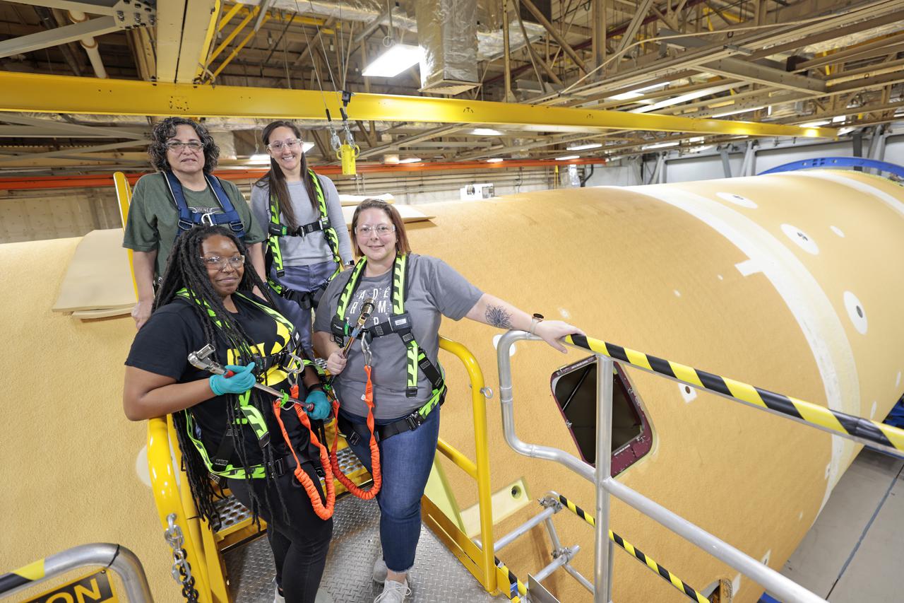 NASA joined the Space Launch System rocket’s core stage forward assembly with the 130-foot liquid hydrogen tank for the Artemis II mission on March 18. This completes assembly of four of the five large structures that make up the core stage that will help send the first astronauts to lunar orbit on Artemis II. The 66-foot forward assembly consists of the forward skirt, liquid oxygen tank and the intertank, which were mated earlier. Engineers inserted 360 bolts to connect the forward assembly to the liquid hydrogen tank to make up the bulk of the stage. Only the engine section, which is currently being outfitted and includes the main propulsion systems that connect to the four RS-25 engines, remains to be added to form the final core stage. All parts of the core stage are manufactured by NASA and Boeing, the core stage lead contractor at the agency’s Michoud Assembly Facility in New Orleans. Currently, the team is building core stages for three Artemis missions. The first core stage is stacked with the rest of the SLS rocket, which will launch the Artemis I mission to the Moon this year. Together with its twin solid rocket boosters, the core stage will produce 8.8 million pounds of thrust to send NASA’s Orion spacecraft, astronauts, and supplies beyond Earth’s orbit to the Moon. The SLS rocket and the Orion spacecraft form the foundation for Artemis missions and future deep space exploration. Image credit: NASA/Michael DeMocker