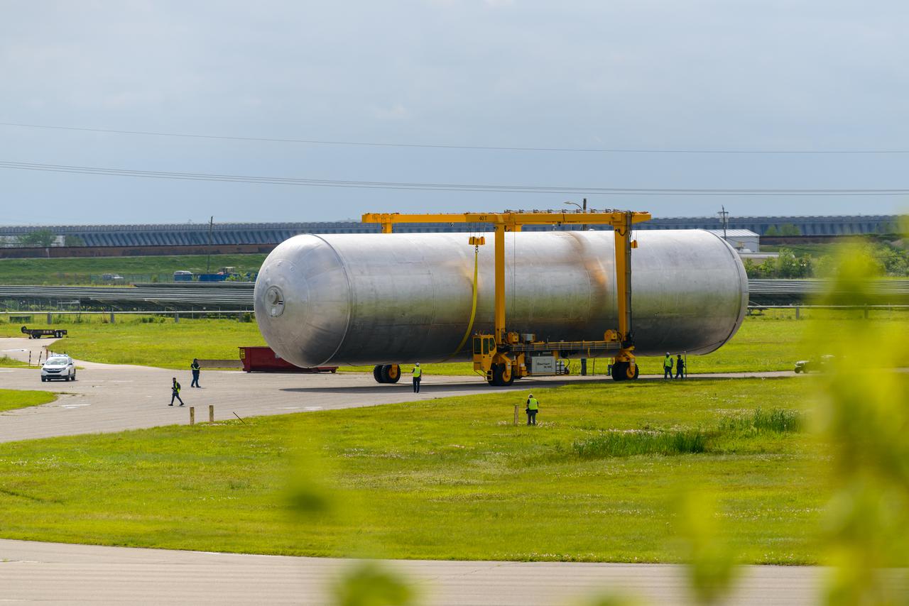The core stage liquid hydrogen tank for the Artemis III mission completed proof testing, and technicians returned it to the main factory building at NASA’s Michoud Assembly Facility in New Orleans where it will undergo more outfitting. As part of proof testing, technicians apply a simple soap solution and check for leaks by observing any bubble formation on the welds. The technician removed the bubble solution with distilled water and then dried the area of application to prevent corrosion. To build the Space Launch System (SLS) rocket’s 130-foot core stage liquid hydrogen tank, engineers use robotic tools to weld five-barrel segments. This process results in a tank with around 1,900 feet, or more than six football fields, of welds that must be tested by hand. After the leak tests, the core stage lead, Boeing, pressurized the SLS tank to further ensure there were no leaks. After it passed proof testing, technicians moved the Artemis III liquid hydrogen tank to Michoud’s main factory. Soon, the technicians will prime and apply a foam-based thermal protection system that protects the tank during launch. Later, the tank will be joined with other parts of the core stage to form the entire 212-foot rocket stage with its four RS-25 engines that produce 2 million pounds of thrust to help launch the rocket. Artemis III will land the first astronauts on the lunar surface. Photographed on Monday, April 18, 2022. 