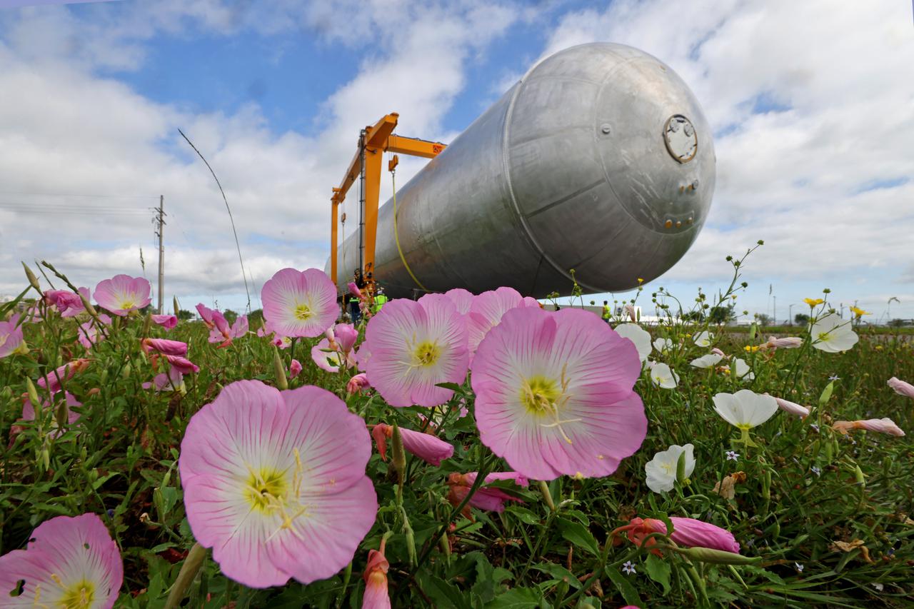 The core stage liquid hydrogen tank for the Artemis III mission completed proof testing, and technicians returned it to the main factory building at NASA’s Michoud Assembly Facility in New Orleans where it will undergo more outfitting. As part of proof testing, technicians apply a simple soap solution and check for leaks by observing any bubble formation on the welds. The technician removed the bubble solution with distilled water and then dried the area of application to prevent corrosion. To build the Space Launch System (SLS) rocket’s 130-foot core stage liquid hydrogen tank, engineers use robotic tools to weld five-barrel segments. This process results in a tank with around 1,900 feet, or more than six football fields, of welds that must be tested by hand.  After the leak tests, the core stage lead, Boeing, pressurized the SLS tank to further ensure there were no leaks.  After it passed proof testing, technicians moved the Artemis III liquid hydrogen tank to Michoud’s main factory. Soon, the technicians will prime and apply a foam-based thermal protection system that protects the tank during launch. Later, the tank will be joined with other parts of the core stage to form the entire 212-foot rocket stage with its four RS-25 engines that produce 2 million pounds of thrust to help launch the rocket. Artemis III will land the first astronauts on the lunar surface. Photographed on Monday, April 18, 2022. Image credit: NASA/Michael DeMocker