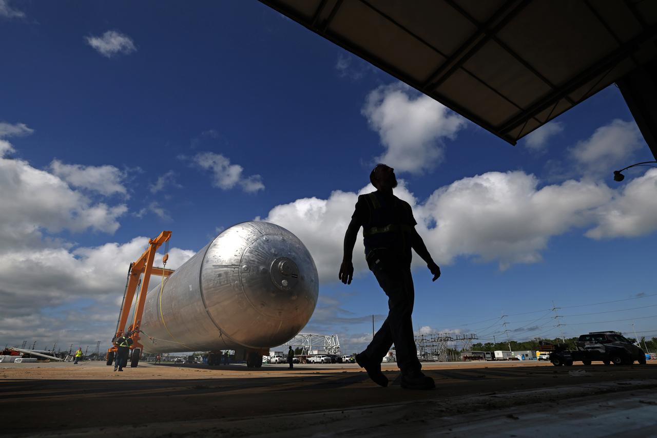 The core stage liquid hydrogen tank for the Artemis III mission completed proof testing, and technicians returned it to the main factory building at NASA’s Michoud Assembly Facility in New Orleans where it will undergo more outfitting. As part of proof testing, technicians apply a simple soap solution and check for leaks by observing any bubble formation on the welds. The technician removed the bubble solution with distilled water and then dried the area of application to prevent corrosion. To build the Space Launch System (SLS) rocket’s 130-foot core stage liquid hydrogen tank, engineers use robotic tools to weld five-barrel segments. This process results in a tank with around 1,900 feet, or more than six football fields, of welds that must be tested by hand.  After the leak tests, the core stage lead, Boeing, pressurized the SLS tank to further ensure there were no leaks.  After it passed proof testing, technicians moved the Artemis III liquid hydrogen tank to Michoud’s main factory. Soon, the technicians will prime and apply a foam-based thermal protection system that protects the tank during launch. Later, the tank will be joined with other parts of the core stage to form the entire 212-foot rocket stage with its four RS-25 engines that produce 2 million pounds of thrust to help launch the rocket. Artemis III will land the first astronauts on the lunar surface. Photographed on Monday, April 18, 2022. Image credit: NASA/Michael DeMocker