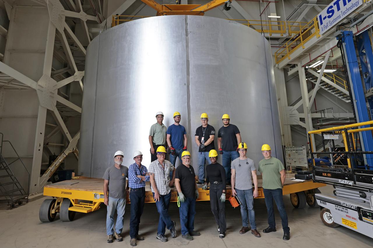 Move crews at NASA’s Michoud Assembly Facility lift the aft liquid oxygen tank (LOX) barrel out of the Vertical Weld Center (VWC) for its next phase of production. The aft barrel will eventually be mated with the forward barrel and the forward and aft domes to form the LOX tank, which will be used in the Space Launch System’s (SLS) Artemis IV mission.   The LOX tank holds 196,000 gallons of super-cooled liquid oxygen to help fuel four RS-25 engines. The SLS core stage is made up of five unique elements: the forward skirt, liquid oxygen tank, intertank, liquid hydrogen tank, and the engine section. The liquid oxygen hardware, along with the liquid hydrogen tank will provide propellant to the four RS-25 engines to produce more than two million pounds of thrust to help launch NASA’s Orion spacecraft, astronauts, and supplies beyond Earth’s orbit to the Moon. Together with its four RS-25 engines, the rocket’s massive 212-foot-tall core stage — the largest stage NASA has ever built — and its twin solid rocket boosters will produce 8.8 million pounds of thrust to send NASA’s Orion spacecraft, astronauts, and supplies beyond Earth’s orbit to the Moon and, ultimately, Mars. Offering more payload mass, volume capability and energy to speed missions through space, the SLS rocket, along with NASA’s Gateway in lunar orbit, the Human Landing System, and Orion spacecraft, is part of NASA’s backbone for deep space exploration and the Artemis lunar program. No other rocket is capable of carrying astronauts in Orion around the Moon in a single mission. Photographed on Tuesday, May 10, 2022. Image credit: NASA/Michael DeMocker