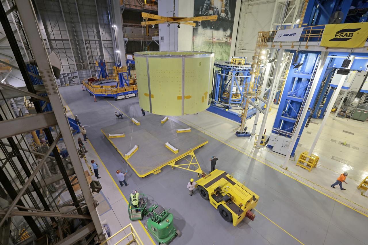Technicians at NASA’s Michoud Assembly Facility move the engine section of NASA’s Space Launch System rocket for Artemis IV from the Vertical Assembly Building to Cell G for weld priming. This hardware is the first large piece manufactured for the Artemis IV mission and makes up the lowest portion of the 212-foot-tall core stage. When complete, the engine section will house the four RS-25 engines and include vital systems for mounting, controlling and delivering fuel from the propellant tanks to the rocket’s engines. Together with its four RS-25 engines and its twin solid rocket boosters, it will produce 8.8 million pounds of thrust to send NASA’s Orion spacecraft, astronauts, and supplies beyond Earth’s orbit to the Moon and, ultimately, Mars. Offering more payload mass, volume capability, and energy to speed missions through space, the SLS rocket, along with NASA’s Gateway in lunar orbit, the Human Landing System, and Orion spacecraft, is part of NASA’s backbone for deep space exploration and the Artemis lunar program. No other rocket is capable of carrying astronauts in Orion around the Moon in a single mission. Image credit: NASA/Michael DeMocker