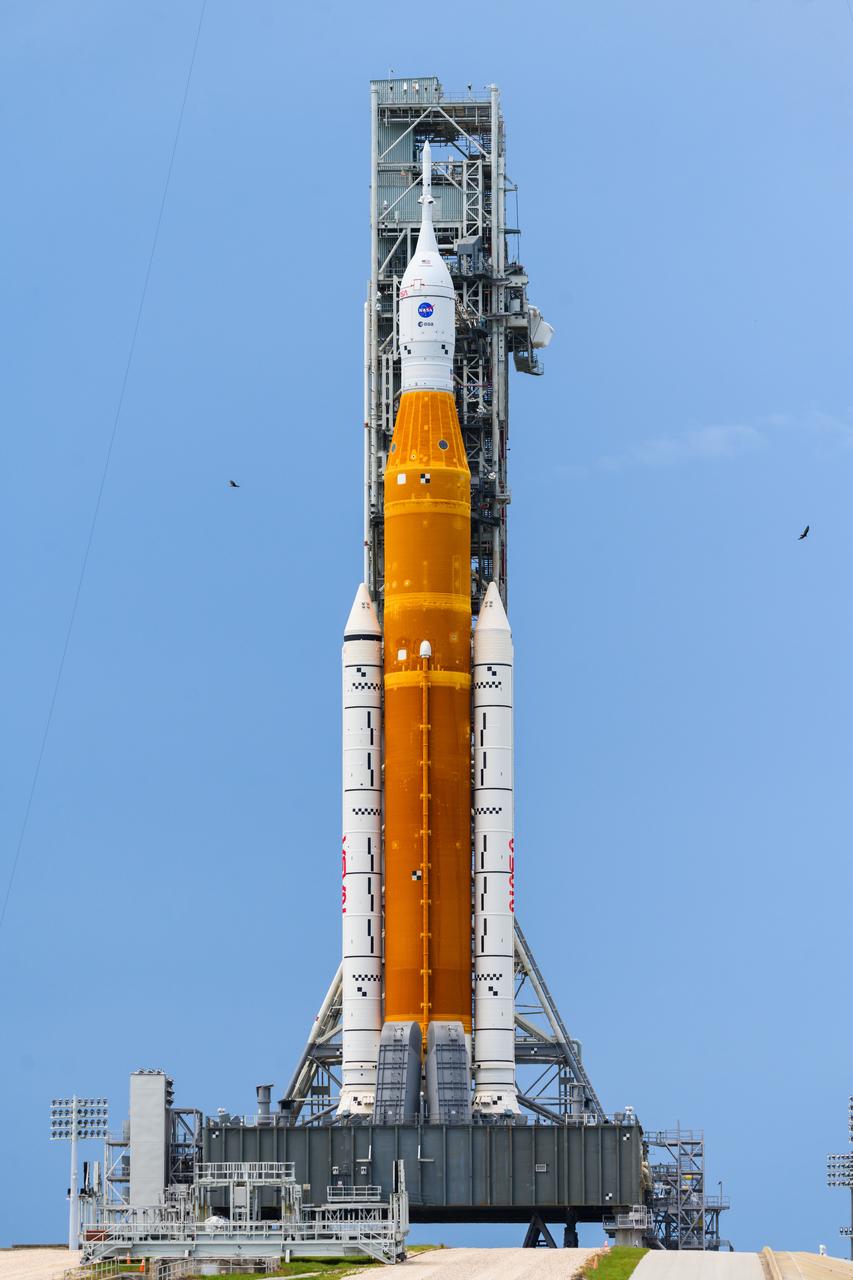 NASA’s Space Launch System (SLS) rocket with the Orion spacecraft aboard is seen atop the mobile launcher at Launch 39B at NASA’s Kennedy Space Center in Florida. Artemis I mission is the first integrated test of the agency’s deep space exploration systems: the Space Launch System rocket, Orion spacecraft, and supporting ground systems. The mission is the first in a series of increasingly complex missions to the Moon. Launch of the uncrewed flight test is targeted for no earlier than Aug. 29 at 8:33 a.m. ET. With Artemis missions, NASA will land the first woman and first person of color on the Moon, using innovative technologies to explore more of the lunar surface than ever before.