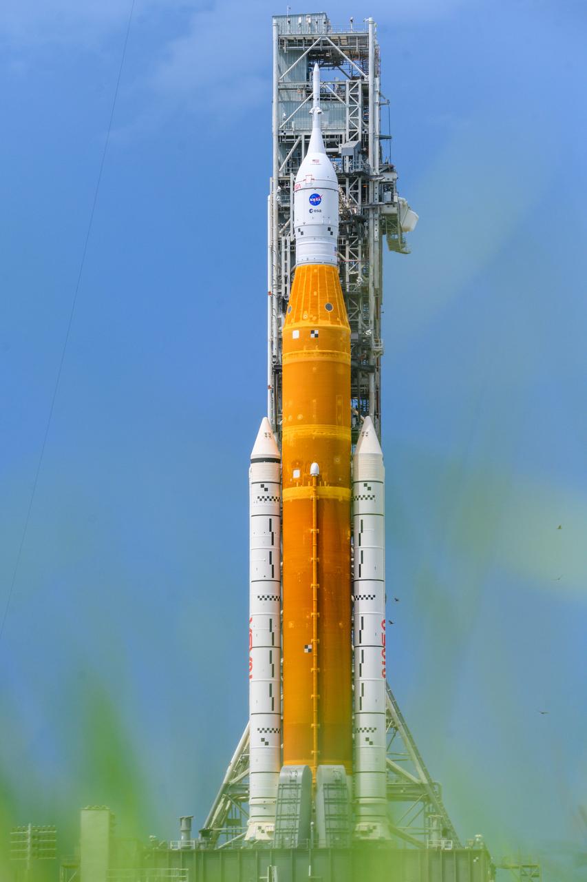 NASA’s Space Launch System (SLS) rocket with the Orion spacecraft aboard is seen atop the mobile launcher at Launch 39B at NASA’s Kennedy Space Center in Florida. Artemis I mission is the first integrated test of the agency’s deep space exploration systems: the Space Launch System rocket, Orion spacecraft, and supporting ground systems. The mission is the first in a series of increasingly complex missions to the Moon. Launch of the uncrewed flight test is targeted for no earlier than Aug. 29 at 8:33 a.m. ET. With Artemis missions, NASA will land the first woman and first person of color on the Moon, using innovative technologies to explore more of the lunar surface than ever before.