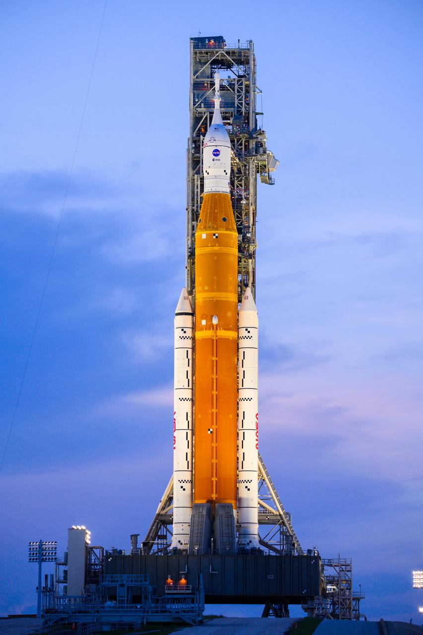 NASA’s Space Launch System (SLS) rocket with the Orion spacecraft aboard is seen atop the mobile launcher at Launch 39B at NASA’s Kennedy Space Center in Florida. Artemis I mission is the first integrated test of the agency’s deep space exploration systems: the Space Launch System rocket, Orion spacecraft, and supporting ground systems. The mission is the first in a series of increasingly complex missions to the Moon. Launch of the uncrewed flight test is targeted for no earlier than Sept. 3 at 2:17 p.m. ET. With Artemis missions, NASA will land the first woman and first person of color on the Moon, using innovative technologies to explore more of the lunar surface than ever before.