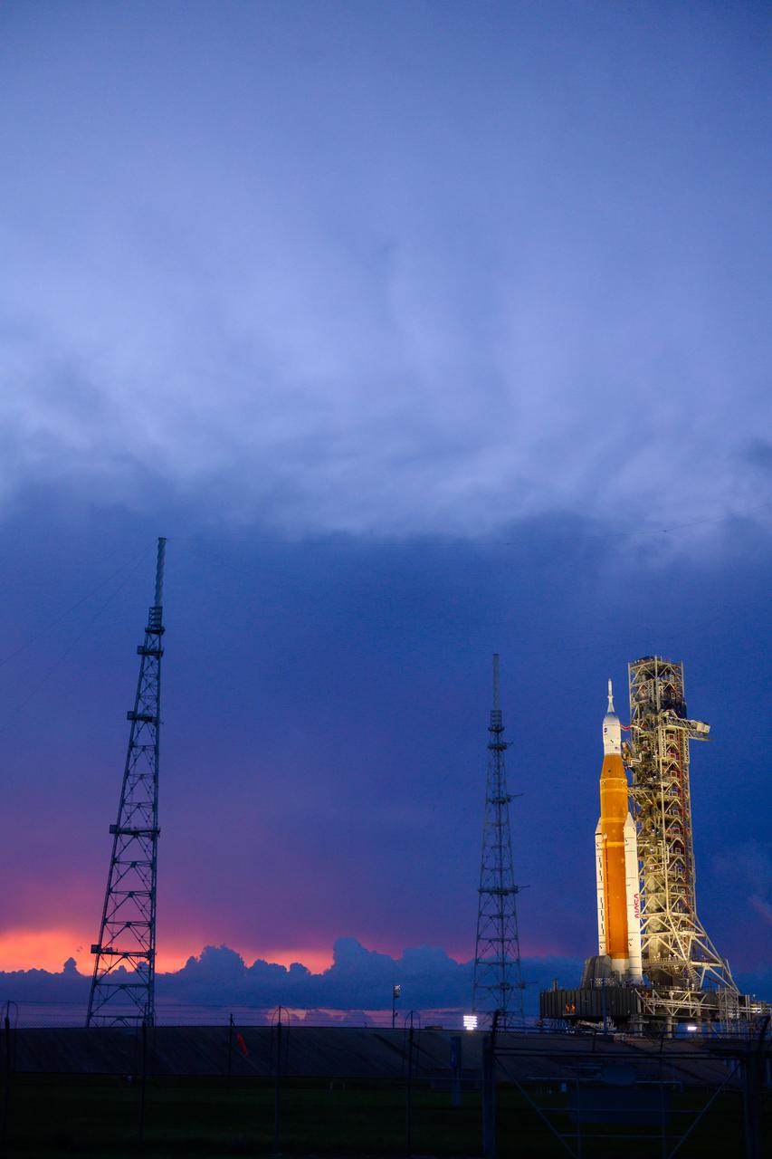 NASA’s Space Launch System (SLS) rocket with the Orion spacecraft aboard is seen atop the mobile launcher at Launch 39B at NASA’s Kennedy Space Center in Florida. Artemis I mission is the first integrated test of the agency’s deep space exploration systems: the Space Launch System rocket, Orion spacecraft, and supporting ground systems. The mission is the first in a series of increasingly complex missions to the Moon. Launch of the uncrewed flight test is targeted for no earlier than Sept. 3 at 2:17 p.m. ET. With Artemis missions, NASA will land the first woman and first person of color on the Moon, using innovative technologies to explore more of the lunar surface than ever before.