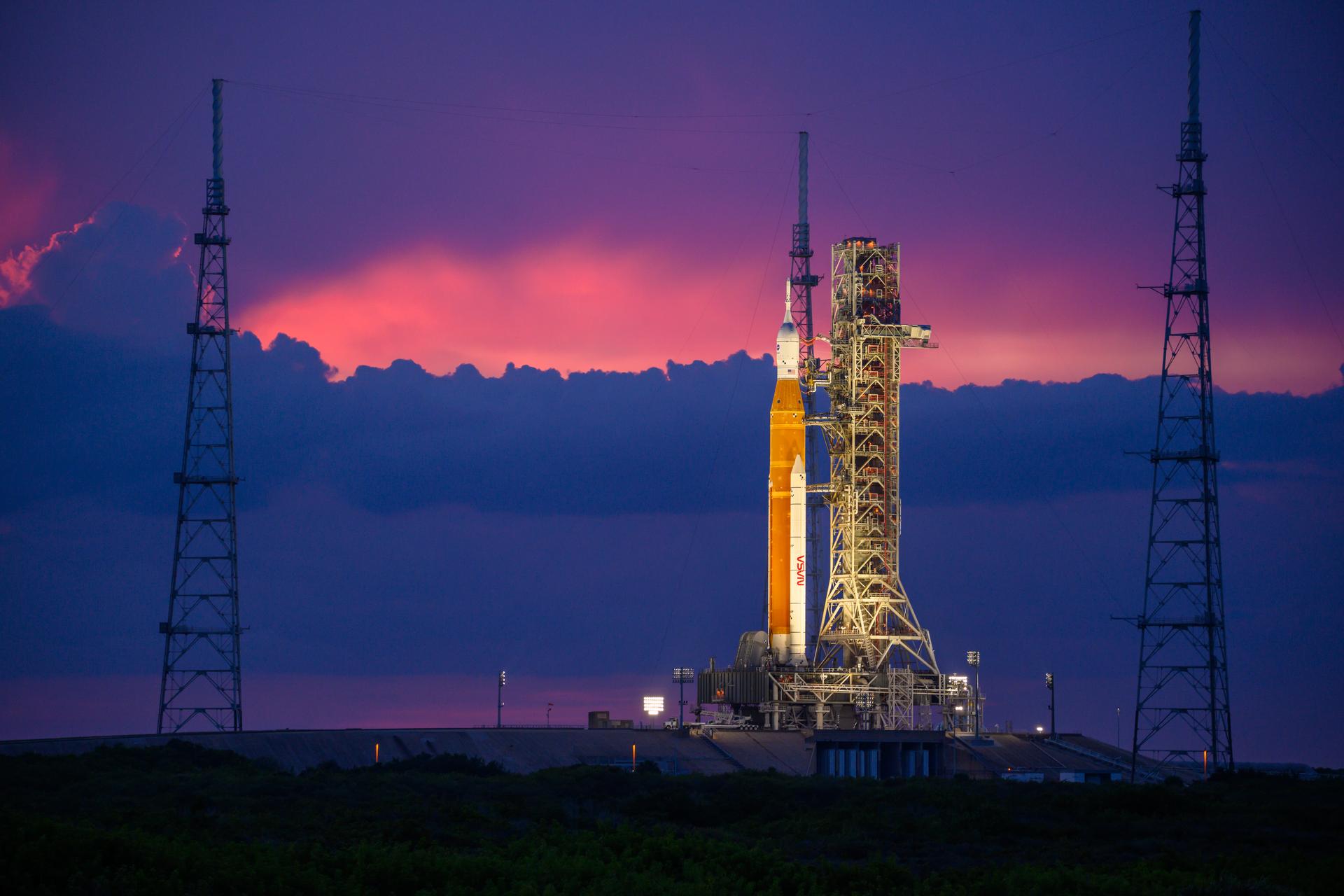 NASA’s Space Launch System (SLS) rocket with the Orion spacecraft aboard is seen atop the mobile launcher at Launch 39B at NASA’s Kennedy Space Center in Florida. Artemis I mission is the first integrated test of the agency’s deep space exploration systems: the Space Launch System rocket, Orion spacecraft, and supporting ground systems. The mission is the first in a series of increasingly complex missions to the Moon. Launch of the uncrewed flight test is targeted for no earlier than Sept. 3 at 2:17 p.m. ET. With Artemis missions, NASA will land the first woman and first person of color on the Moon, using innovative technologies to explore more of the lunar surface than ever before.