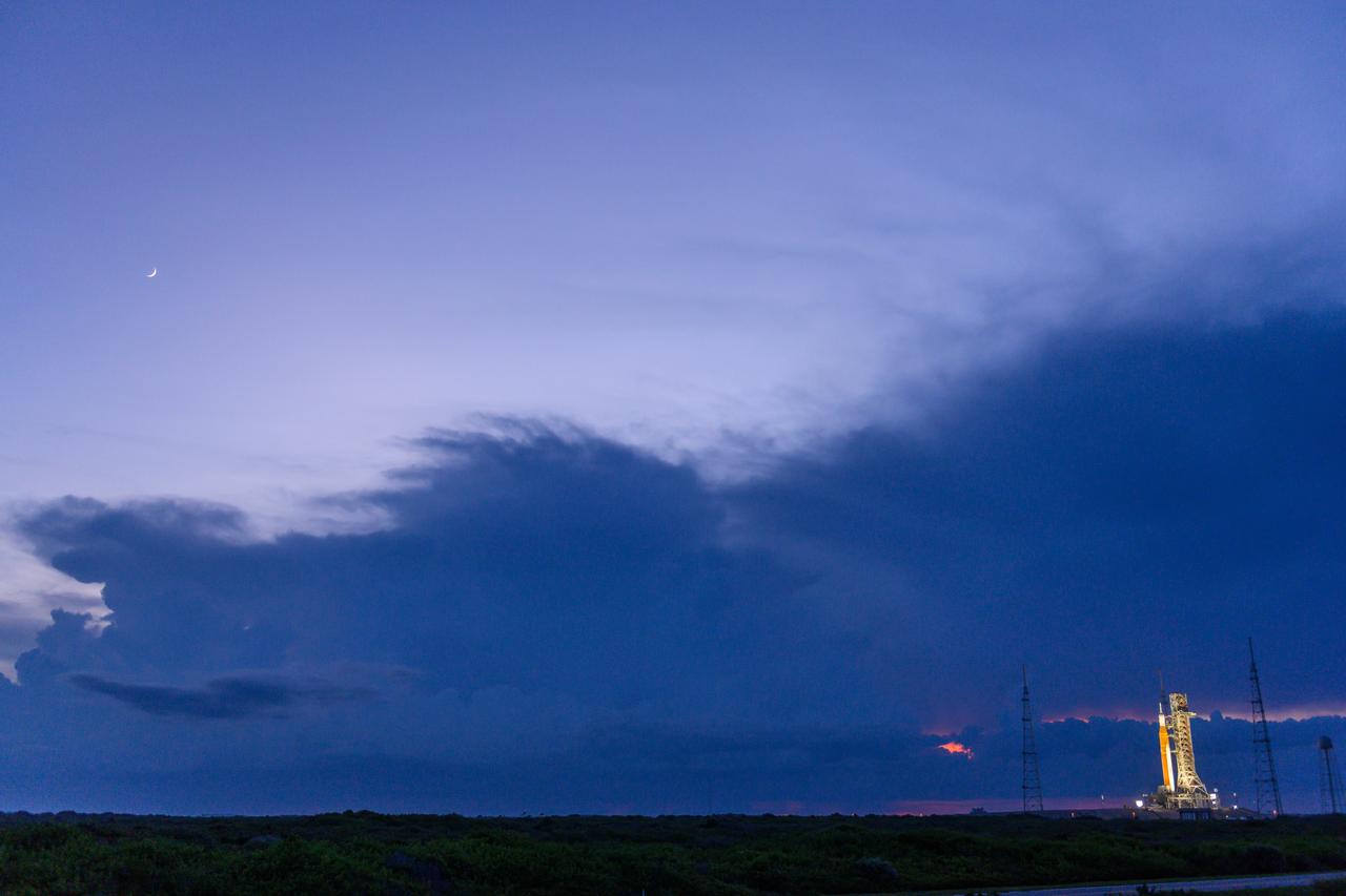 NASA’s Space Launch System (SLS) rocket with the Orion spacecraft aboard is seen atop the mobile launcher at Launch 39B at NASA’s Kennedy Space Center in Florida. Artemis I mission is the first integrated test of the agency’s deep space exploration systems: the Space Launch System rocket, Orion spacecraft, and supporting ground systems. The mission is the first in a series of increasingly complex missions to the Moon. Launch of the uncrewed flight test is targeted for no earlier than Sept. 3 at 2:17 p.m. ET. With Artemis missions, NASA will land the first woman and first person of color on the Moon, using innovative technologies to explore more of the lunar surface than ever before.