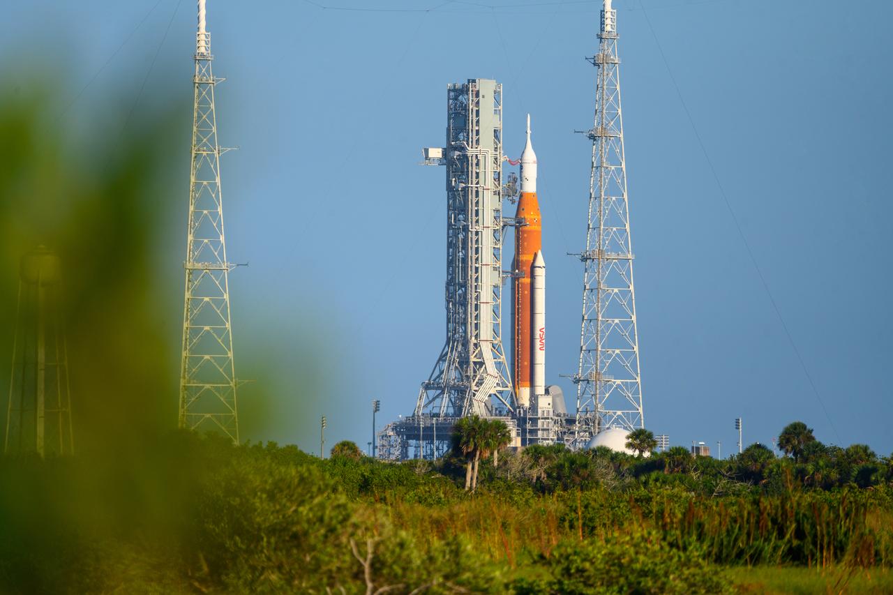 NASA’s Space Launch System (SLS) rocket with the Orion spacecraft aboard is seen atop the mobile launcher at Launch 39B at NASA’s Kennedy Space Center in Florida. Artemis I mission is the first integrated test of the agency’s deep space exploration systems: the Space Launch System rocket, Orion spacecraft, and supporting ground systems. The mission is the first in a series of increasingly complex missions to the Moon. Launch of the uncrewed flight test is targeted for no earlier than Sept. 3 at 2:17 p.m. ET. With Artemis missions, NASA will land the first woman and first person of color on the Moon, using innovative technologies to explore more of the lunar surface than ever before.