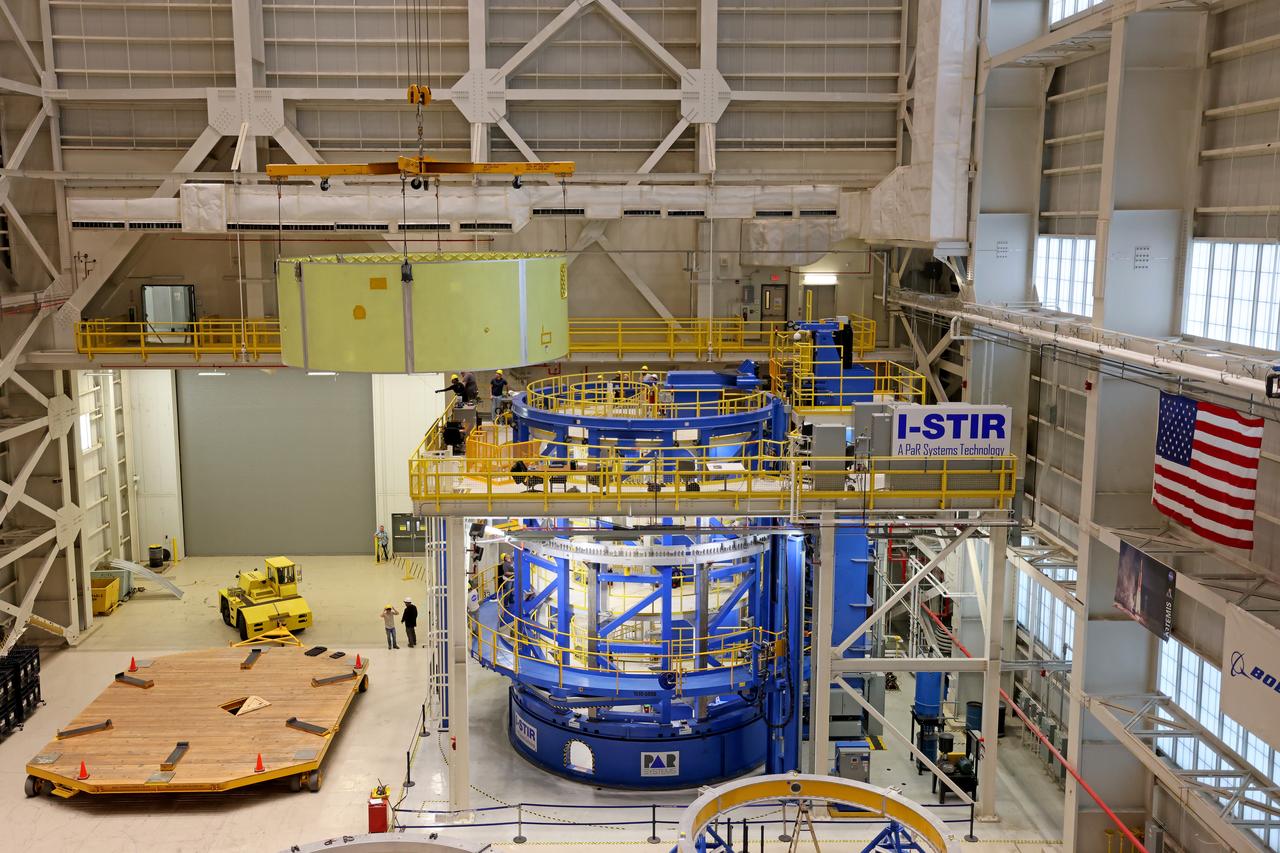 Crews at NASA’s Michoud Assembly Facility in New Orleans lift the forward skirt of a core stage that will power NASA’s Space Launch System (SLS) rocket out of the Vertical Weld Center Sept. 16, 2022. The forward skirt will be used for NASA’s Artemis IV mission. The hardware houses flight computers, cameras, and avionics systems for the SLS rocket. The SLS core stage is made up of five unique elements: the forward skirt, liquid oxygen tank, intertank, liquid hydrogen tank, and the engine section. When fully stacked, the forward skirt is located at the top of the 212-foot-tall core stage and connects to the upper part of the rocket. The core stage and its four RS-25 engines provide more than 2 million pounds of thrust to help power NASA’s next-generation lunar missions. Image credit: NASA/Michael DeMocker 