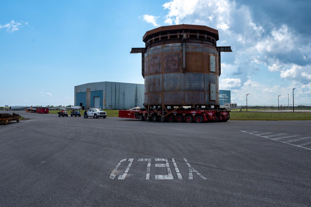 Move crews at NASA’s Michoud Assembly Facility in New Orleans guide the Inter-Stage Simulator (ISS) to the Michoud deep water port on Monday, Sept. 19 in preparation for transportation by barge to the agency’s Stennis Space Center near Bay St. Louis, Mississippi.  Crews will lift the simulator into the B2 Test Stand at Stennis, where it holds the Exploration Upper Stage (EUS) in place and acts as a thrust takeout. ISS protects the lower portion of the EUS from environmental elements during its Green Run tests. The term “green” refers to the new hardware, and “run” refers to operation all the components together for the first time. During tanking and launch for its future mission, the lower portion is shrouded in a flight interstage. EUS is part of the SLS Block 1B configuration. The more powerful configuration of the SLS rocket will provide in-space propulsion to send astronauts in NASA’s Orion spacecraft and 40% more cargo mass on a precise trajectory to the Moon. Through the Artemis missions, NASA will land the first woman and the first person of color on the Moon to pave the way for a sustainable presence on the Moon and future missions beyond.
