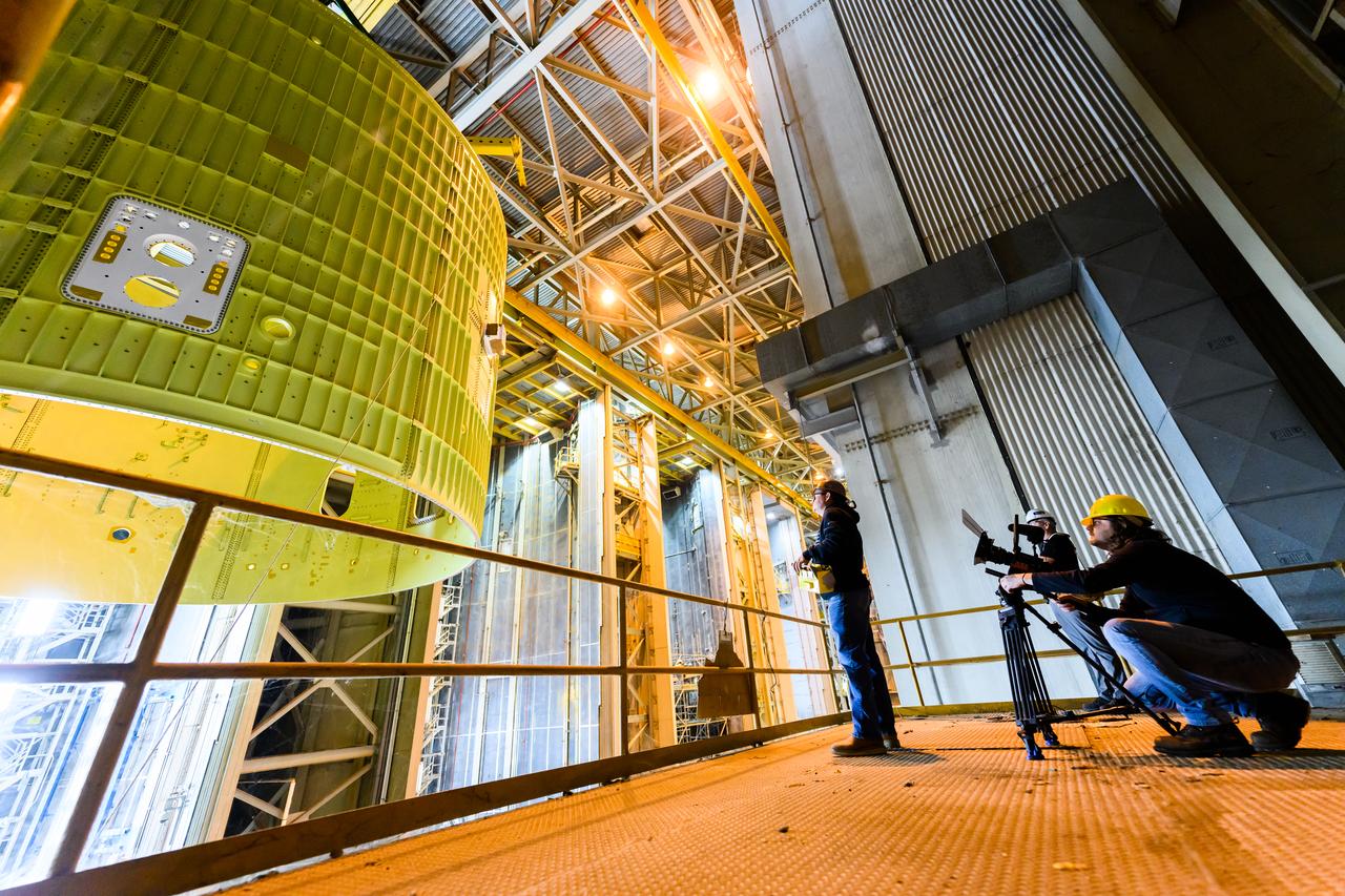 Technicians at NASA’s Michoud Assembly Facility move the intertank of NASA’s Space Launch System rocket for Artemis III to Cell G on October 26, 2022 to await application of the thermal protection system. Thermal protection systems protect space vehicles from aerodynamic heating during entry to planet atmosphere and re-entry to earth atmosphere. The intertank lays between the liquid hydrogen tank and liquid oxygen tank. Together with the engine section and the forward skirt, they comprise the SLS core stage. The liquid hydrogen tank and liquid oxygen tank hold 733,000 gallons of propellant to power the stage’s four RS-25 engines needed for liftoff and Artemis missions to the Moon and future missions to Mars.