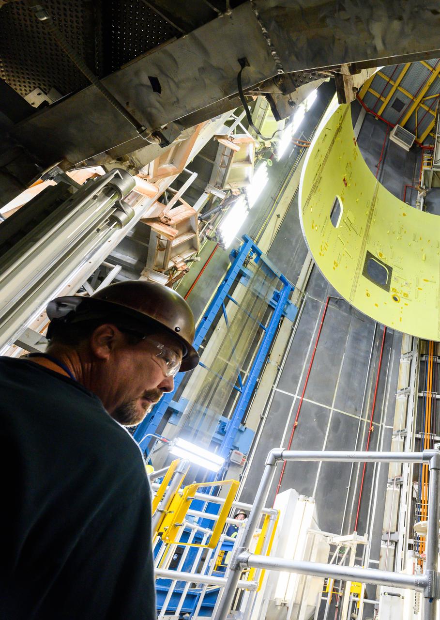 Technicians at NASA’s Michoud Assembly Facility move the intertank of NASA’s Space Launch System rocket for Artemis III to Cell G on October 26, 2022 to await application of the thermal protection system. Thermal protection systems protect space vehicles from aerodynamic heating during entry to planet atmosphere and re-entry to earth atmosphere. The intertank lays between the liquid hydrogen tank and liquid oxygen tank. Together with the engine section and the forward skirt, they comprise the SLS core stage. The liquid hydrogen tank and liquid oxygen tank hold 733,000 gallons of propellant to power the stage’s four RS-25 engines needed for liftoff and Artemis missions to the Moon and future missions to Mars.