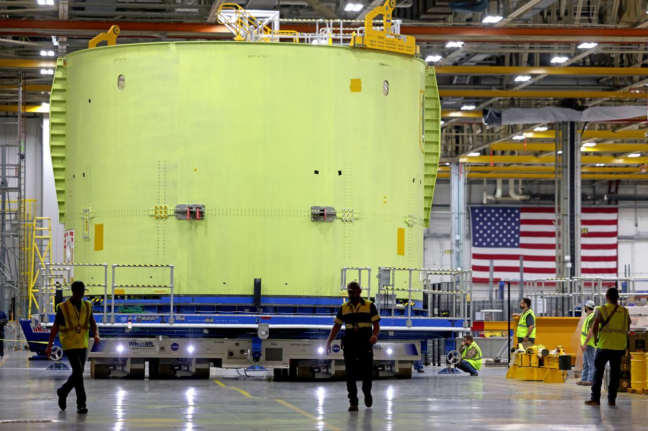 Technicians at NASA’s Michoud Assembly Facility move the engine section of NASA’s Space Launch System rocket for Artemis III to the VAB on November 7, 2022. This hardware makes up the lowest portion of the 212-foot-tall core stage; and when complete, it will house the four RS-25 engines as well as vital systems for mounting, controlling, and delivering fuel from the propellant tanks to the rocket’s engines. Together with its four RS-25 engines and its twin solid rocket boosters, it will produce 8.8 million pounds of thrust to send NASA’s Orion spacecraft, astronauts, and supplies beyond Earth’s orbit to the Moon and, ultimately, Mars. Offering more payload mass, volume capability, and energy to speed missions through space, the SLS rocket, along with NASA’s Gateway in lunar orbit, the Humane Landing System, and Orion spacecraft, is part of NASA’s backbone for deep space exploration and the Artemis lunar program. No other rocket is capable of carrying astronauts in Orion around the Moon in a single mission. Image credit: NASA/Michael DeMocker