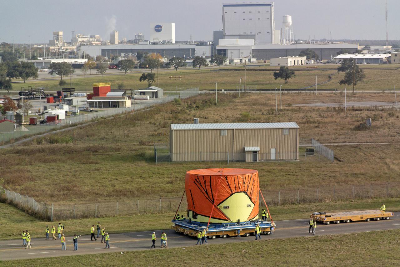 Teams at NASA’s Michoud Assembly Facility in New Orleans move the engine section flight hardware to the agency’s Pegasus barge on Sunday, December 4, 2022. The barge will ferry the engine section of NASA’s Space Launch System (SLS) rocket for Artemis III to the agency’s Kennedy Space Center in Florida. Once there, teams at Kennedy will finish outfitting the engine section, which comprises the tail-end of the rocket’s 212-foot-tall core stage, before integrating it to the rest of the stage. Beginning with production for Artemis III, NASA and core stage lead contractor Boeing will use Michoud, where the SLS core stages are currently manufactured, to produce and outfit the core stage’s five elements, and available space at Kennedy for final assembly and integration.  Image credit: NASA/Michael DeMocker