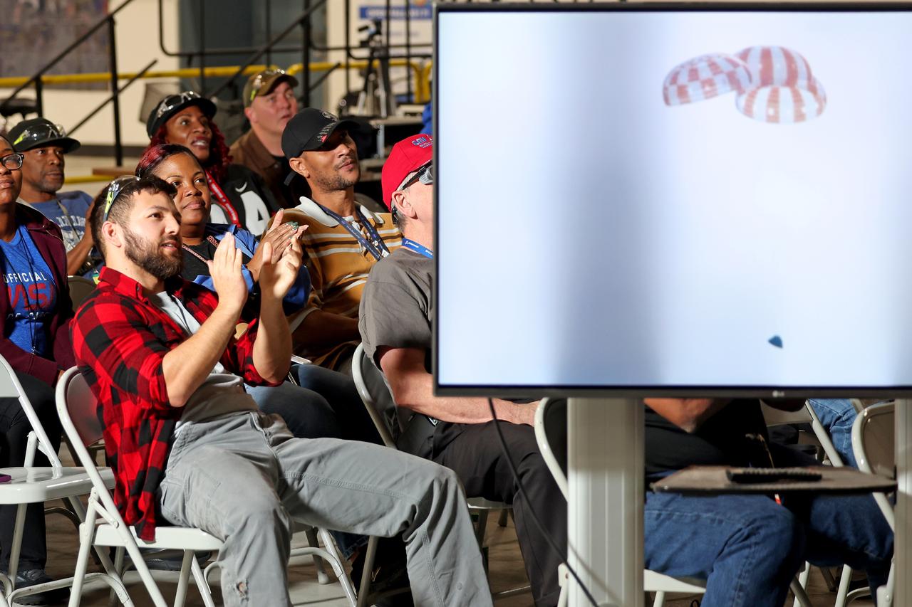 Employees at NASA’s Michoud Assembly Facility in New Orleans gather to watch the completion of NASA’s Artemis I mission with the splashdown of the Orion spacecraft on Dec. 11. The team cheered as the capsule safely returned to Earth following its 25.5-day mission, which brought it further into deep space than any human-rated spacecraft has ever flown before.  The Orion crew capsule as well as parts for the launch abort system and the core stage of the Space Launch System rocket were built at the Michoud Assembly Facility.  Artemis I is the first in a series of increasingly complex missions to the Moon. With the Artemis missions, NASA will land the first woman and the first person of color on the Moon. No other rocket is capable of carrying astronauts in Orion around the Moon in a single mission.   Image credit: NASA/Michael DeMocker