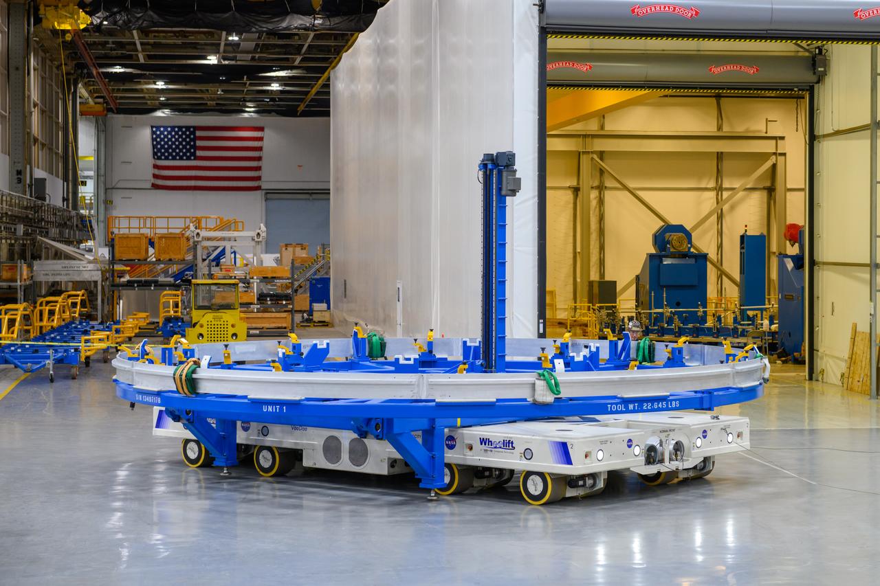 Technicians at NASA’s Michoud Assembly Facility in New Orleans lift a ring for the Exploration Upper Stage (EUS) of the SLS (Space Launch System) rocket to move it to another location in the 43-acre factory for further inspection and production. Flight hardware of the SLS EUS, a more powerful in-space propulsion stage beginning with Artemis IV, is in early production at Michoud. The rings make up the barrel sections for the flight hardware. The Exploration Upper Stage will be used on the second configuration of the SLS rocket, known as Block 1B, and will provide in-space propulsion to send astronauts in NASA’s Orion spacecraft and heavy cargo on a precise trajectory to the Moon. EUS will replace the interim cryogenic propulsion stage for the Block 1 configuration of SLS. It has larger propellant tanks and four RL10 engines, enabling SLS to launch 40% more cargo to the Moon along with crew. NASA and Boeing, the SLS lead contractor for the core stage and EUS, are currently manufacturing stages for Artemis II, III, IV, and V at the factory. NASA is working to land the first woman and first person of color on the Moon under Artemis. SLS is part of NASA’s backbone for deep space exploration, along with Orion and the Gateway in orbit around the Moon. SLS is the only rocket that can send Orion, astronauts, and supplies to the Moon in a single mission.