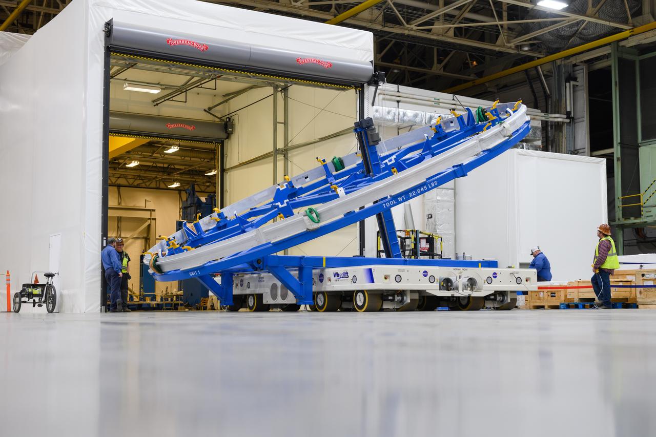 Technicians at NASA’s Michoud Assembly Facility in New Orleans lift a ring for the Exploration Upper Stage (EUS) of the SLS (Space Launch System) rocket to move it to another location in the 43-acre factory for further inspection and production. Flight hardware of the SLS EUS, a more powerful in-space propulsion stage beginning with Artemis IV, is in early production at Michoud. The rings make up the barrel sections for the flight hardware. The Exploration Upper Stage will be used on the second configuration of the SLS rocket, known as Block 1B, and will provide in-space propulsion to send astronauts in NASA’s Orion spacecraft and heavy cargo on a precise trajectory to the Moon. EUS will replace the interim cryogenic propulsion stage for the Block 1 configuration of SLS. It has larger propellant tanks and four RL10 engines, enabling SLS to launch 40% more cargo to the Moon along with crew. NASA and Boeing, the SLS lead contractor for the core stage and EUS, are currently manufacturing stages for Artemis II, III, IV, and V at the factory. NASA is working to land the first woman and first person of color on the Moon under Artemis. SLS is part of NASA’s backbone for deep space exploration, along with Orion and the Gateway in orbit around the Moon. SLS is the only rocket that can send Orion, astronauts, and supplies to the Moon in a single mission.