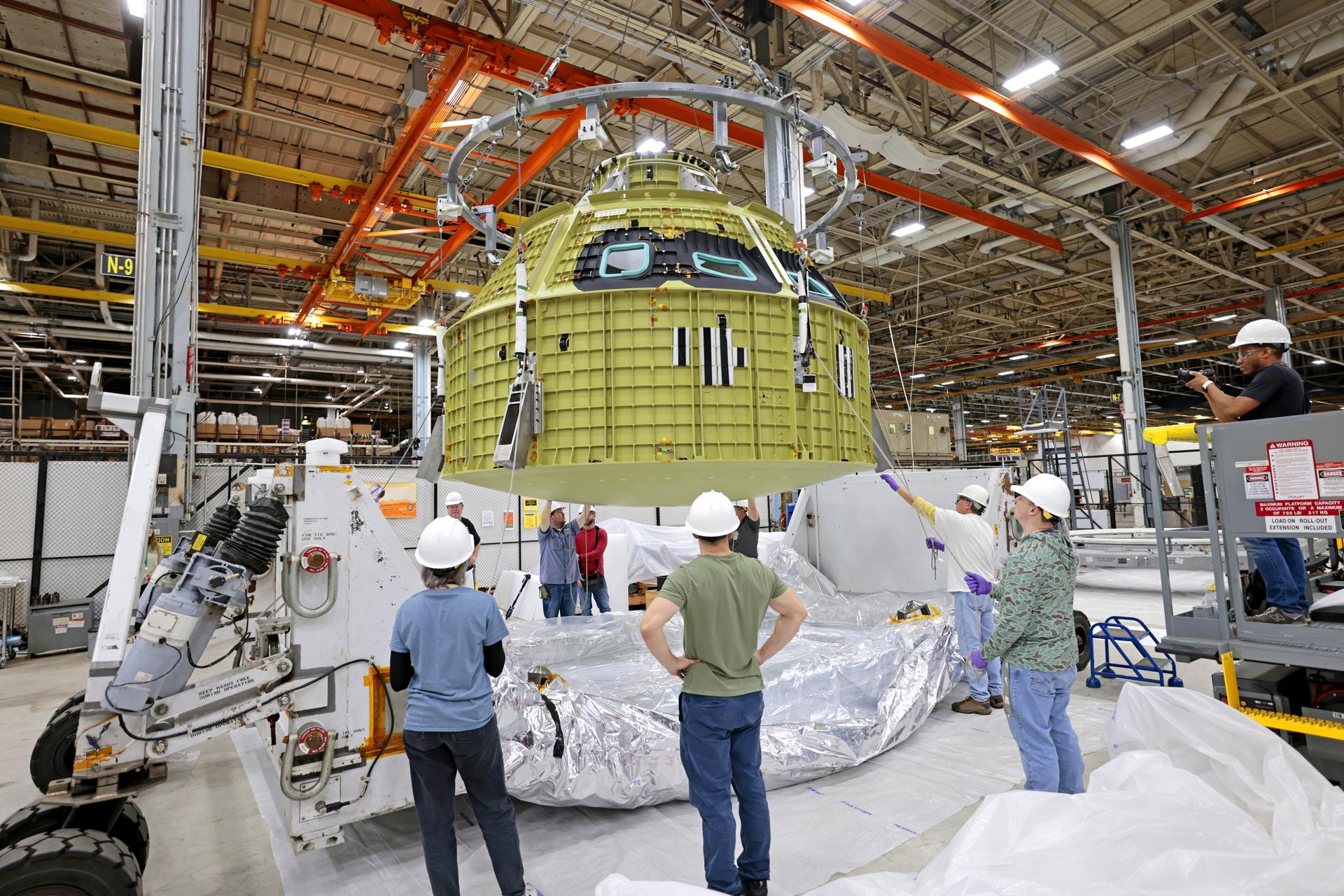 Teams at NASA’s Michoud Assembly Facility in New Orleans prepare the completed Orion pressure vessel for the Artemis IV mission for shipment to NASA’s Kennedy Space Center in Florida. The pressure vessel, which was assembled by lead contractor, Lockheed Martin, is the Orion crew module primary structure – the core upon which all other elements of Orion’s crew module are integrated. The structure is critical to Artemis crews as it holds the pressurized atmosphere astronauts breathe and work in a while in the vacuum of deep space. Once the module arrives at Kennedy’s Vehicle Assembly Building high bay, teams will begin integration of the pressure vessel with the Orion spacecraft crew module adapter and other assembly. With Artemis missions, NASA will land the first woman and the first person of color on the lunar surface, paving the way for human exploration of the Moon and on to Mars.  Image credit: NASA/Michael DeMocker