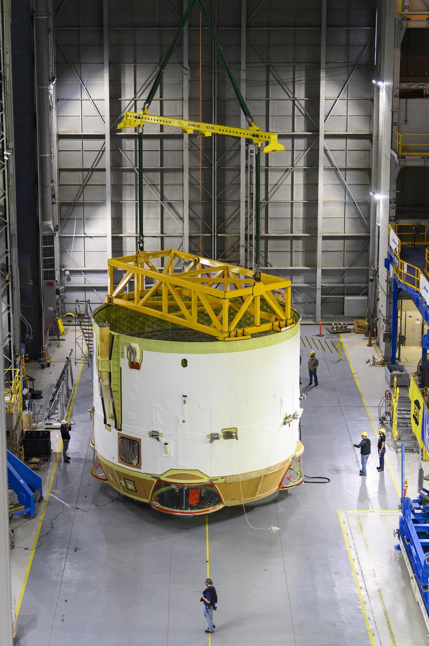 Technicians at NASA’s Michoud Assembly Facility in New Orleans flipped the engine section of NASA’s Space Launch System rocket for Artemis II from a vertical to a horizontal position Feb. 11. The flip, also known as a breakover, is in preparation for the final assembly and integration into the core stage for the second SLS rocket. The engine section is the bottom-most portion of the 212-foot-tall core stage and is one of the most complex and intricate portions of the rocket that will help power the first crewed Artemis mission to the Moon. It is the last of five elements that is needed to join the stage as one structure. In addition to its miles of cabling and hundreds of sensors, the engine section is a crucial attachment point for the four RS-25 engines and two solid rocket boosters that produce a combined 8.8 million pounds of thrust at liftoff and flight.  Next, teams will move the engine section into the final assembly area where they will complete the join. After the join is complete, teams will begin to add each of the four RS-25 engines. The completely assembled stage with its four RS-25 engines will be shipped to NASA’s Kennedy Space Center in Florida later this year. The SLS rocket is the only rocket capable of carrying astronauts in Orion around the Moon in a single mission. Image credit: NASA/Eric Bordelon