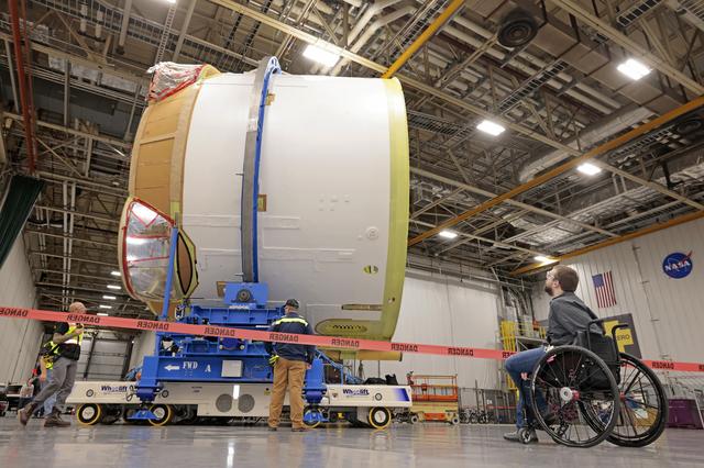 NASA image: Teams Move Artemis II SLS Engine Section into Position for Final Join