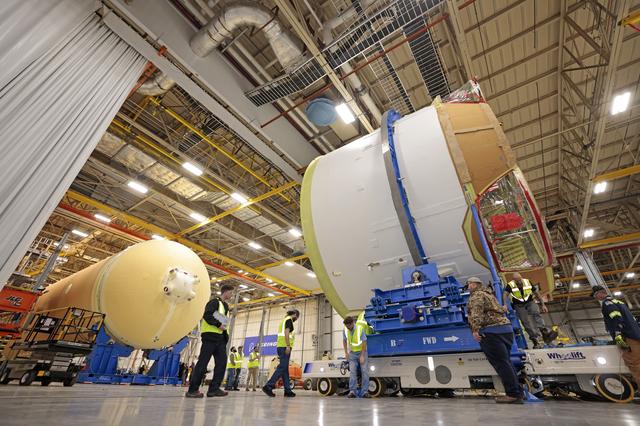 NASA image: Teams Move Artemis II SLS Engine Section into Position for Final Join
