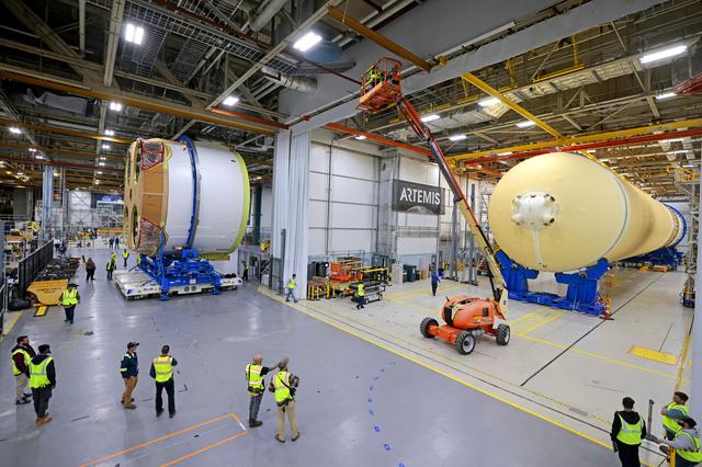 NASA image: Teams Move Artemis II SLS Engine Section into Position for Final Join