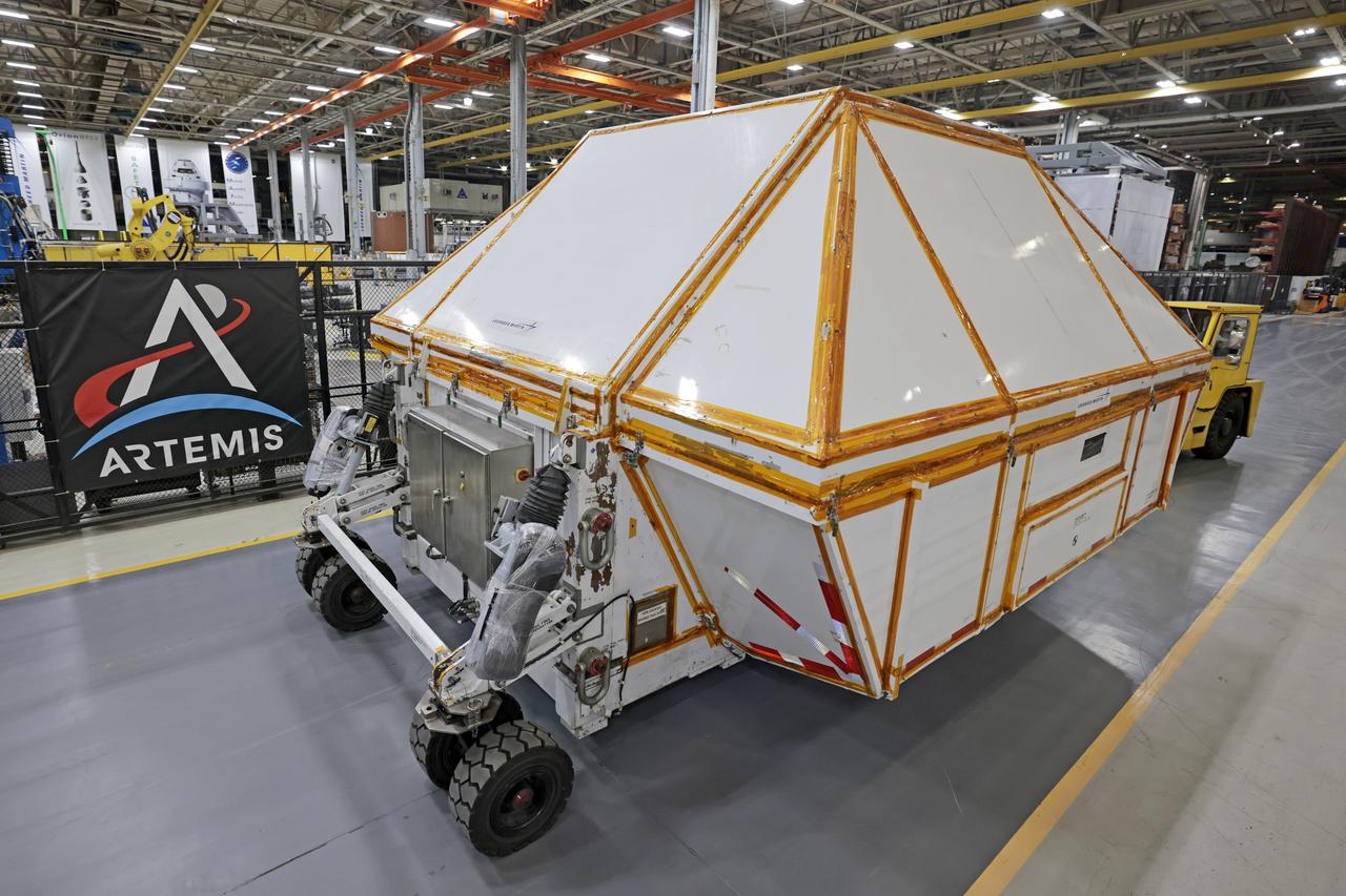 Teams at NASA’s Michoud Assembly Facility in New Orleans prepare the completed Orion pressure vessel for the Artemis IV mission for shipment to NASA’s Kennedy Space Center in Florida. The pressure vessel, which was assembled by lead contractor, Lockheed Martin, is the Orion crew module primary structure – the core upon which all other elements of Orion’s crew module are integrated. The structure is critical to Artemis crews as it holds the pressurized atmosphere astronauts breathe and work in a while in the vacuum of deep space. Once the module arrives at Kennedy’s Vehicle Assembly Building high bay, teams will begin integration of the pressure vessel with the Orion spacecraft crew module adapter and other assembly. With Artemis missions, NASA will land the first woman and the first person of color on the lunar surface, paving the way for human exploration of the Moon and on to Mars.  Image credit: NASA/Michael DeMocker