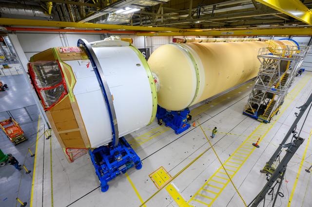 NASA image: Teams Move Artemis II SLS Engine Section into Position for Final Join
