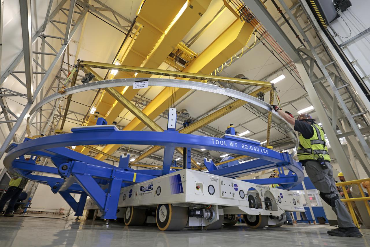 Technicians at NASA’s Michoud Assembly Facility in New Orleans lift a ring for the Exploration Upper Stage (EUS) of the SLS (Space Launch System) rocket to move it to another location in the 43-acre factory for further inspection and production. Flight hardware of the SLS EUS, a more powerful in-space propulsion stage beginning with Artemis IV, is in early production at Michoud. The rings make up the barrel sections for the flight hardware. The Exploration Upper Stage will be used on the second configuration of the SLS rocket, known as Block 1B, and will provide in-space propulsion to send astronauts in NASA’s Orion spacecraft and heavy cargo on a precise trajectory to the Moon. EUS will replace the interim cryogenic propulsion stage for the Block 1 configuration of SLS. It has larger propellant tanks and four RL10 engines, enabling SLS to launch 40% more cargo to the Moon along with crew. NASA and Boeing, the SLS lead contractor for the core stage and EUS, are currently manufacturing stages for Artemis II, III, IV, and V at the factory. NASA is working to land the first woman and first person of color on the Moon under Artemis. SLS is part of NASA’s backbone for deep space exploration, along with Orion and the Gateway in orbit around the Moon. SLS is the only rocket that can send Orion, astronauts, and supplies to the Moon in a single mission.