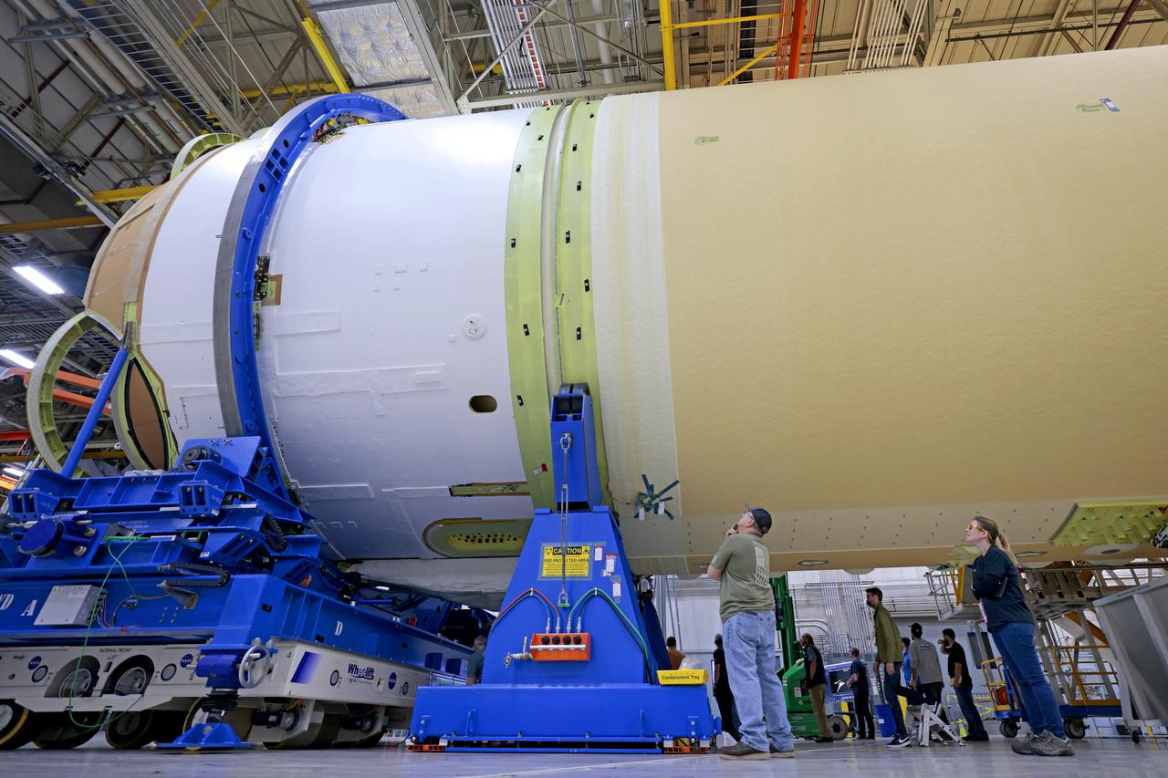 Teams with NASA and Boeing, the core stage lead contractor, at NASA’s Michoud Assembly Facility in New Orleans have fully integrated all five major structures of the Space Launch System (SLS) rocket’s core stage for Artemis II, the first Artemis mission that will send four astronauts around the Moon and return them home. Technicians joined the engine section to the rest of the rocket stage March 17. Next, teams will integrate the four RS-25 engines to the engine section to complete the stage. Located at the bottom of the 212-foot-tall core stage, the engine section is the most complex and intricate part of the rocket stage, helping to power Artemis missions to the Moon. In addition to its miles of cabling and hundreds of sensors, the engine section is a crucial attachment point for the RS-25 engines and two solid rocket boosters that produce a combined 8.8 million pounds of thrust at liftoff. It houses the engines and includes vital systems for mounting, controlling, and delivering fuel from the propellant tanks to the engines. Image credit: NASA/Michael DeMocker