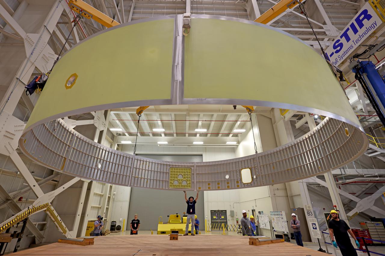 These images and videos show technicians at NASA’s Michoud Assembly Facility in New Orleans examining and lifting midbody barrels for the Exploration Upper Stage (EUS) structural test article of the SLS (Space Launch System) rocket in May 2023. The barrel sections make up the body, or main structure, of the future in-space propulsion stage for the mega rocket. The Exploration Upper Stage will be used on the second configuration of the SLS rocket, known as Block 1B, and will provide in-space propulsion to send astronauts in NASA’s Orion spacecraft and heavy cargo on a precise trajectory to the Moon. Beginning with Artemis IV, EUS will replace the interim cryogenic propulsion stage for the Block 1 configuration of SLS. It has larger propellant tanks and four RL10 engines, enabling SLS to launch 40% more cargo to the Moon along with crew.  EUS flight hardware is in early production at Michoud. Crews with NASA and Boeing, the lead contractor for the SLS core stage and EUS, are also manufacturing the EUS structural test article. The test hardware is structurally identical to the flight version and will be used during a series of strenuous testing that simulates the forces the rocket will experience during launch and flight and verify its structural integrity.   NASA is working to land the first woman and first person of color on the Moon under Artemis. SLS is part of NASA’s backbone for deep space exploration, along with Orion and the Gateway in orbit around the Moon. SLS is the only rocket that can send Orion, astronauts, and supplies to the Moon in a single mission. 