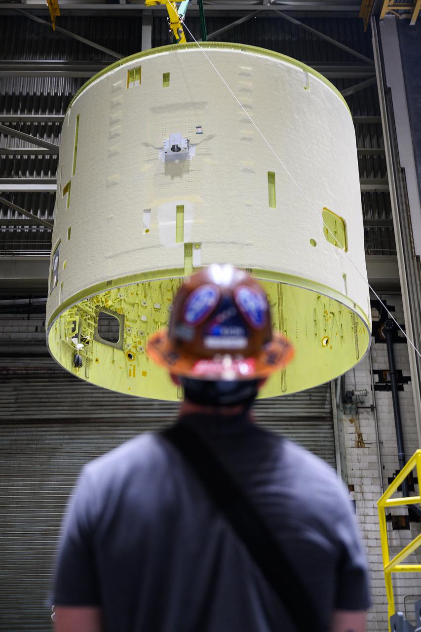 Technicians at NASA’s Michoud Assembly Facility in New Orleans lift the intertank of the SLS (Space Launch System)’s core stage for NASA’s Artemis III mission to move it to another location in the 43-acre factory for further inspection and production.   The intertank is the backbone of the rocket’s core stage and is located between the mega rocket’s liquid hydrogen tank and liquid oxygen tank. In addition to joining the rocket’s two massive propellant tanks, the intertank houses avionics and electronics and serves as an attachment point for the rocket’s two solid rocket boosters positioned on either side of the core stage. The liquid hydrogen tank and liquid oxygen tank hold 733,000 gallons of super-cold propellant to power the stage’s four RS-25 engines needed for liftoff. Together, the rocket’s four RS-25 engines and two solid rocket boosters provide more than 8.8 million pounds to launch NASA’s and Artemis missions to the Moon. NASA is working to land the first woman and first person of color on the Moon under Artemis. SLS is part of NASA’s backbone for deep space exploration, along with Orion and the Gateway in orbit around the Moon. SLS is the only rocket that can send Orion, astronauts, and supplies to the Moon in a single mission. 