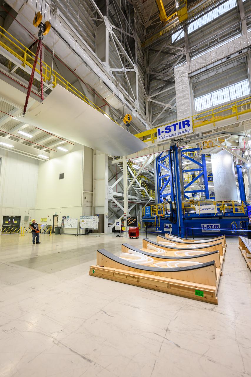 Crews at NASA’s Michoud Assembly Facility in New Orleans load alluminum alloy panels into the Vertical Weld Center June 1. The Vertical Weld Center is a friction-stir weld tool for the large structures of the core stage for the SLS (Space Launch System) rocket. Teams load the panels into the VWC  using an overhead crane system, then multiple panels are welded together to create entire barrels. The panels in these images are some of the five barrels that will form the SLS liquid hydrogen propellant tank for the SLS rocket that will power NASA’s Artemis IV mission, which is also the first flight of SLS in its more powerful Block 1B configuration. The SLS core stage is made up of five unique elements: the forward skirt, liquid oxygen tank, intertank, liquid hydrogen tank, and the engine section. The liquid hydrogen propellant tank holds 537,000 gallons of liquid hydrogen cooled to minus 432 degrees Fahrenheit and sits between the core stage’s intertank and engine section. The liquid hydrogen hardware, along with the liquid oxygen tank, provides propellant to the four RS-25 engines at the bottom of the core stage to produce more than two million pounds of thrust to help launch the Artemis IV mission to the Moon. Together with its four RS-25 engines, the rocket’s massive 212-foot-tall core stage — the largest stage NASA has ever built — and its twin solid rocket boosters produce 8.8 million pounds of thrust to send NASA’s Orion spacecraft, astronauts and supplies beyond Earth’s orbit to the Moon. NASA is working to land the first woman and first person of color on the Moon under Artemis. SLS is part of NASA’s backbone for deep space exploration, along with Orion and the Gateway in orbit around the Moon. SLS is the only rocket that can send Orion, astronauts, and supplies to the Moon in a single mission. 