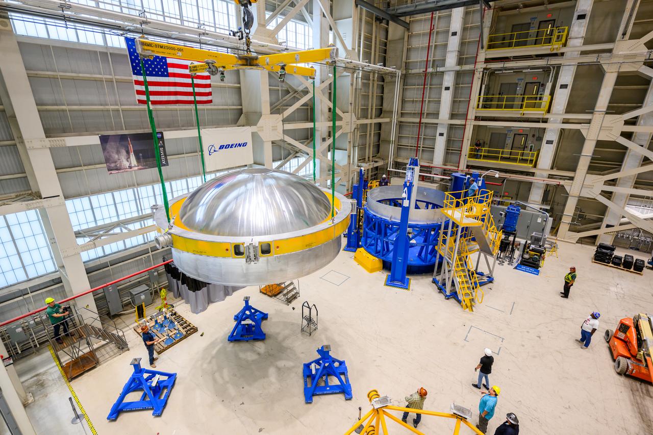 These images show technicians at NASA’s Michoud Assembly Facility in New Orleans lifting and installing the liquid oxygen dome weld confidence article for a future upper stage for NASA’s SLS (Space Launch System) rocket onto the LTAC (LOX Tank Assembly Center) in Building 115 at Michoud for the next phase of manufacturing in July 2023.  The dome makes up a portion of the liquid oxygen tank weld confidence article for the EUS (exploration upper stage). Teams use weld confidence articles to verify welding procedures and structural integrity of the welds to manufacture structural test and flight versions of the hardware.  EUS flight hardware is in early production at Michoud. The more powerful upper stage and its four RL10 engines will be used on the second configuration of the SLS rocket, known as Block 1B, and will provide in-space propulsion to send astronauts in NASA’s Orion spacecraft and heavy cargo on a precise trajectory to the Moon. NASA and Boeing, the lead contractor for the SLS core stage and EUS, are manufacturing SLS stages for Artemis II, III, IV, and V at the facility.   NASA is working to land the first woman and first person of color on the Moon under Artemis. SLS is part of NASA’s backbone for deep space exploration, along with Orion and the Gateway in orbit around the Moon. SLS is the only rocket that can send Orion, astronauts, and supplies to the Moon in a single mission. 